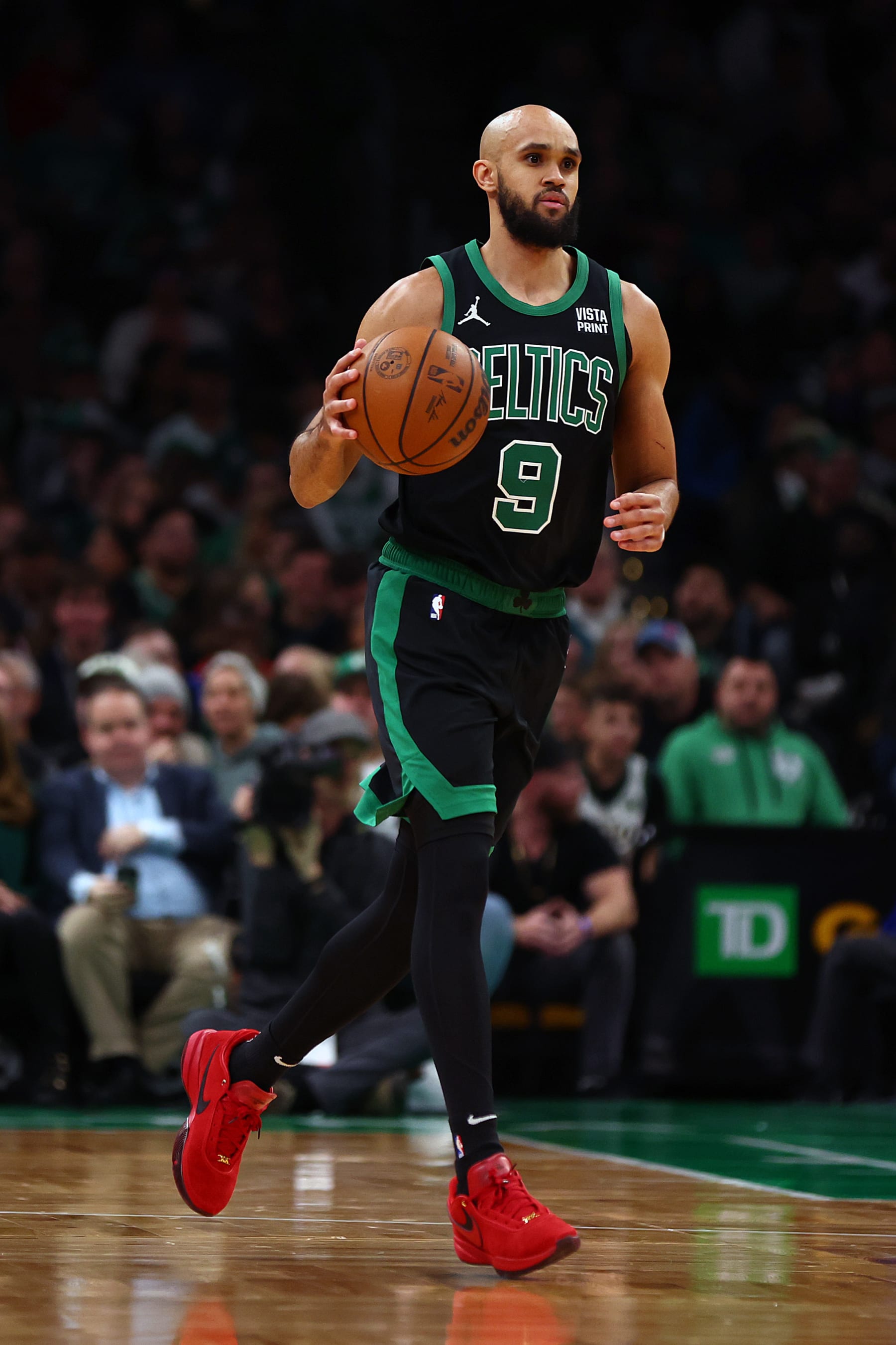 BOSTON, MASSACHUSETTS - DECEMBER 01: Derrick White #9 of the Boston Celtics dribbles downcourt against the Philadelphia 76ers during the first quarter at TD Garden on December 01, 2023 in Boston, Massachusetts. NOTE TO USER: User expressly acknowledges and agrees that, by downloading and or using this photograph, User is consenting to the terms and conditions of the Getty Images License Agreement.  (Photo by Maddie Meyer/Getty Images)