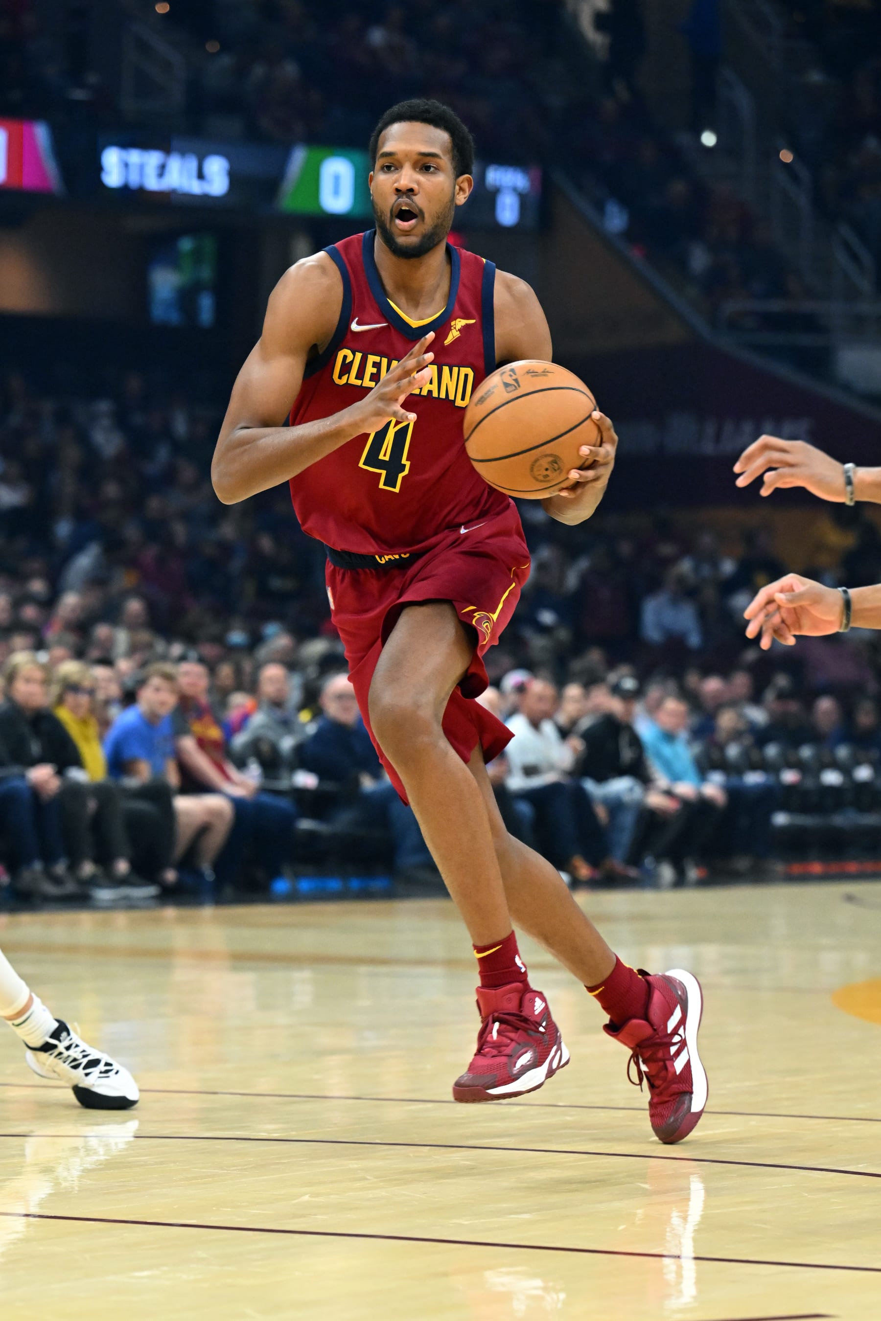 CLEVELAND, OHIO - APRIL 10: Evan Mobley #4 of the Cleveland Cavaliers  brings the ball up court during the first quarter against the Milwaukee Bucks at Rocket Mortgage Fieldhouse on April 10, 2022 in Cleveland, Ohio. NOTE TO USER: User expressly acknowledges and agrees that, by downloading and/or using this photograph, user is consenting to the terms and conditions of the Getty Images License Agreement. (Photo by Jason Miller/Getty Images)