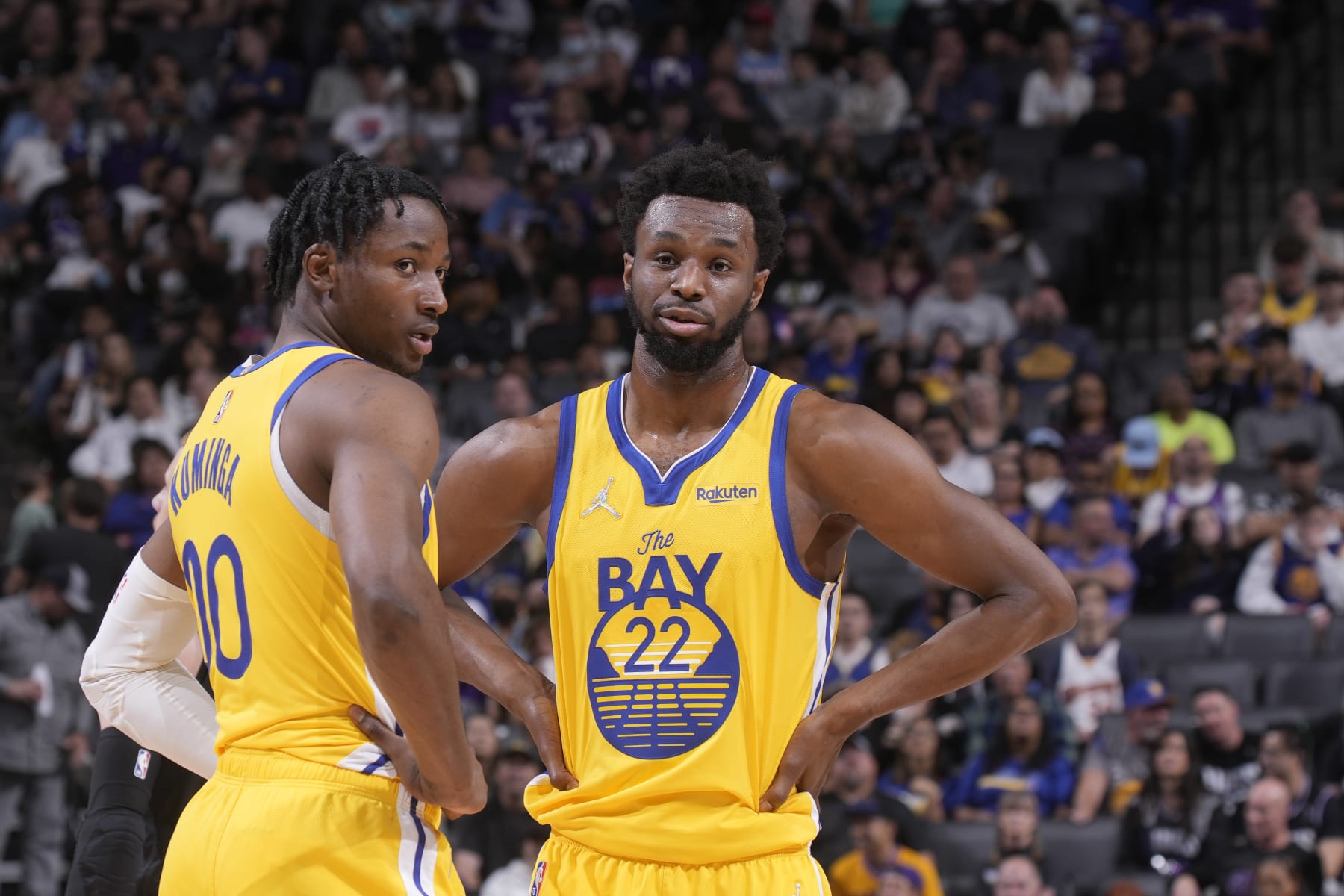 SACRAMENTO, CA - APRIL 3: Jonathan Kuminga #00 and Andrew Wiggins #22 of the Golden State Warriors talk during the game against the Sacramento Kings on April 3, 2022 at Golden 1 Center in Sacramento, California. NOTE TO USER: User expressly acknowledges and agrees that, by downloading and or using this photograph, User is consenting to the terms and conditions of the Getty Images Agreement. Mandatory Copyright Notice: Copyright 2022 NBAE (Photo by Rocky Widner/NBAE via Getty Images)