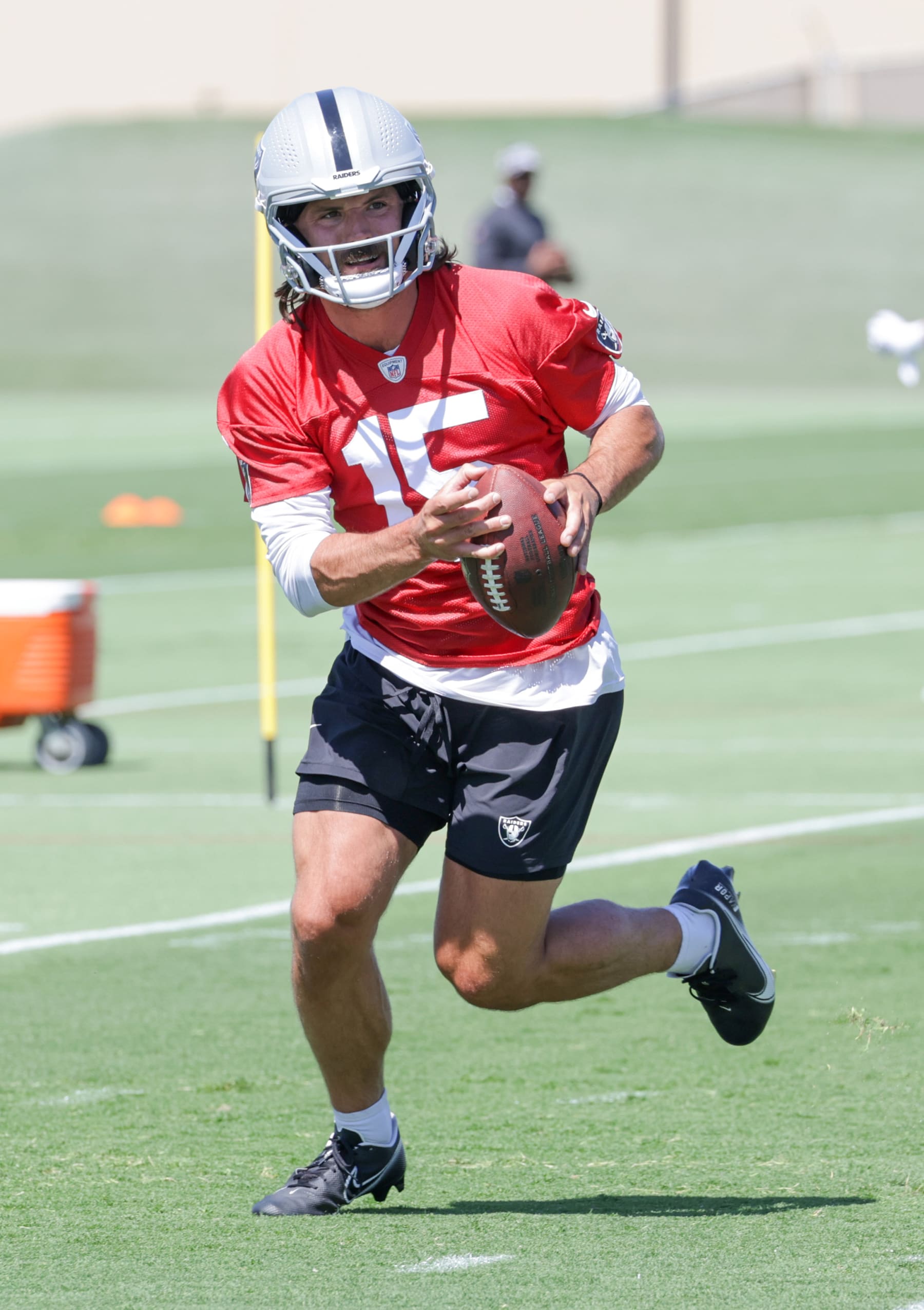 HENDERSON, NEVADA - MAY 29: Quarterback Gardner Minshew #15 of the Las Vegas Raiders runs through a drill during an OTA offseason workout at the Las Vegas Raiders Headquarters/Intermountain Healthcare Performance Center on May 29, 2024 in Henderson, Nevada. (Photo by Ethan Miller/Getty Images)