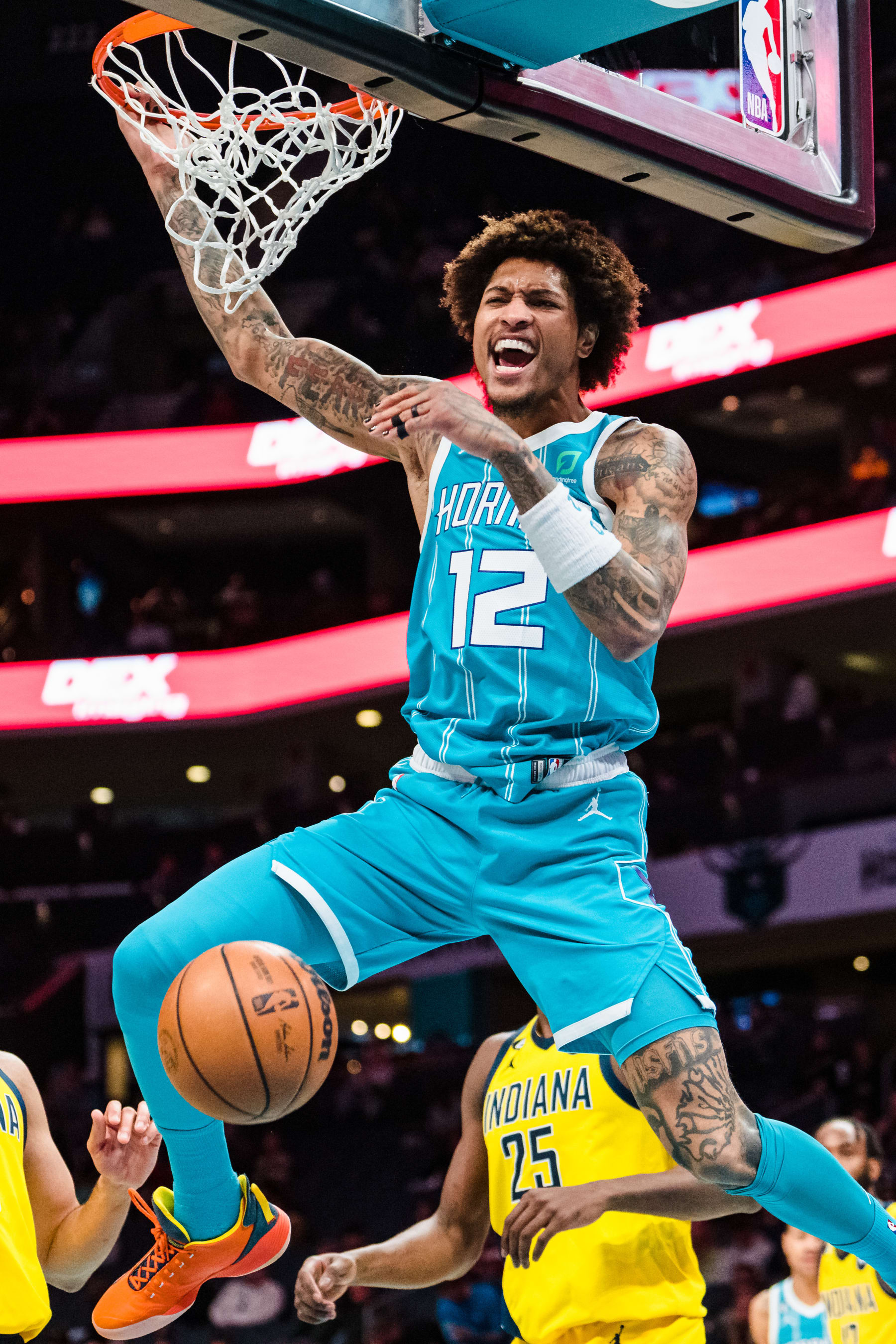 CHARLOTTE, NORTH CAROLINA - MARCH 20: Kelly Oubre Jr. #12 of the Charlotte Hornets dunks the ball in the second quarter during their game against the Indiana Pacers at Spectrum Center on March 20, 2023 in Charlotte, North Carolina. NOTE TO USER: User expressly acknowledges and agrees that, by downloading and or using this photograph, User is consenting to the terms and conditions of the Getty Images License Agreement. (Photo by Jacob Kupferman/Getty Images)