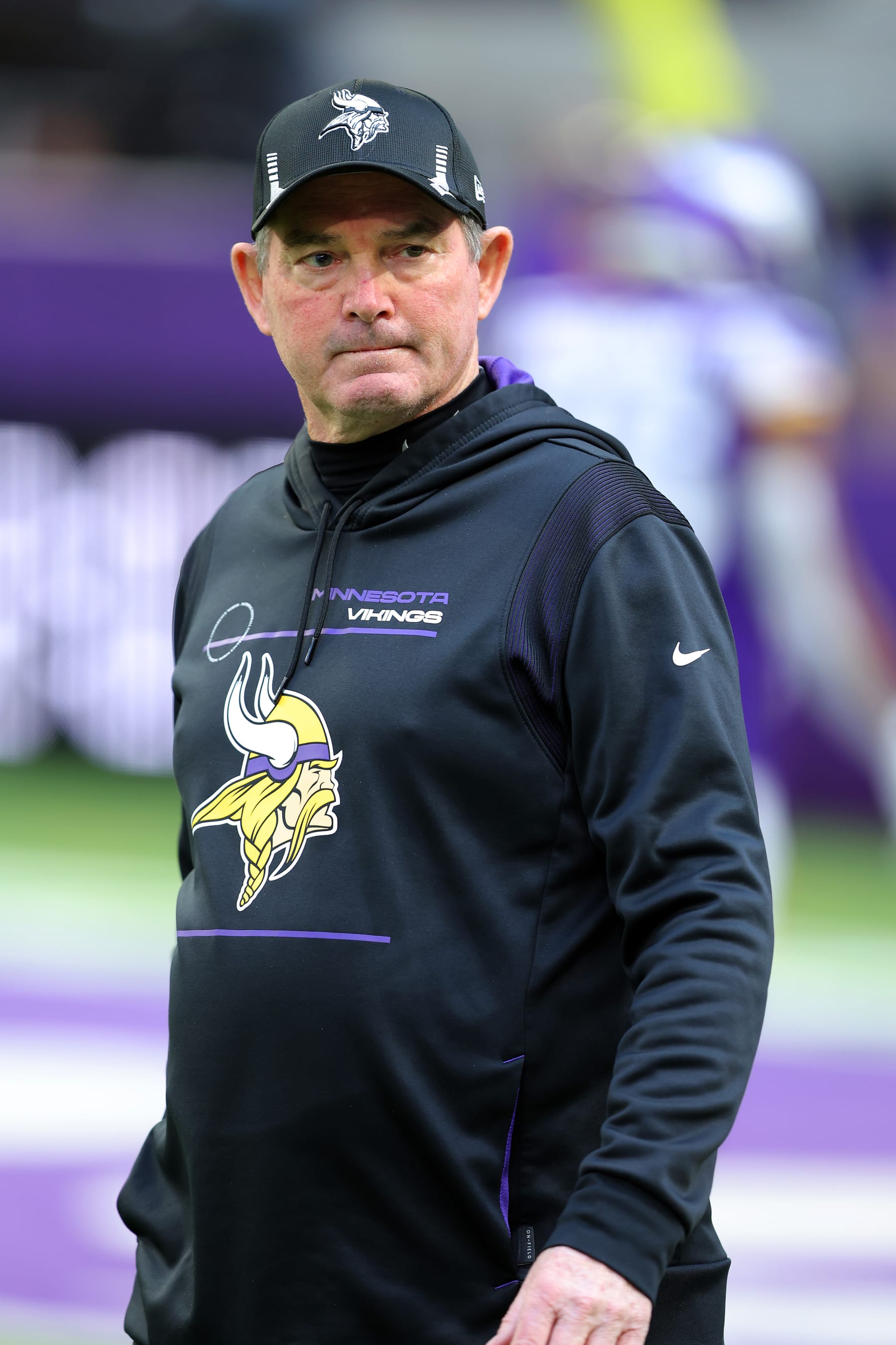 MINNEAPOLIS, MINNESOTA - JANUARY 09: Head coach Mike Zimmer of the Minnesota Vikings looks on during warm ups prior to the game against the Chicago Bears at U.S. Bank Stadium on January 09, 2022 in Minneapolis, Minnesota. (Photo by Adam Bettcher/Getty Images)