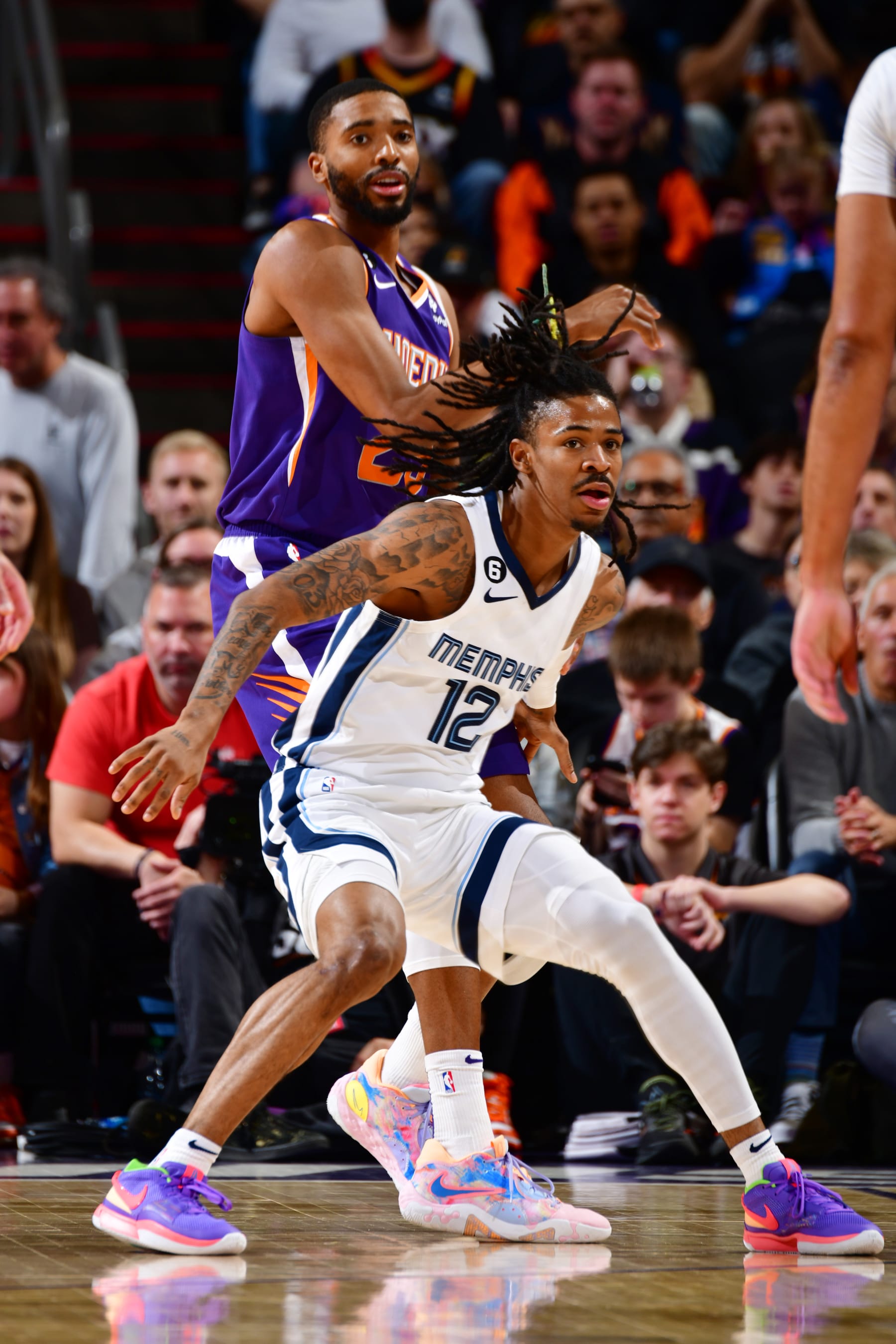 PHOENIX, AZ - JANUARY 22: Ja Morant #12 of the Memphis Grizzlies plays defense during the game against the Phoenix Suns on January 22, 2023 at Footprint Center in Phoenix, Arizona. NOTE TO USER: User expressly acknowledges and agrees that, by downloading and or using this photograph, user is consenting to the terms and conditions of the Getty Images License Agreement. Mandatory Copyright Notice: Copyright 2022 NBAE (Photo by Barry Gossage/NBAE via Getty Images)