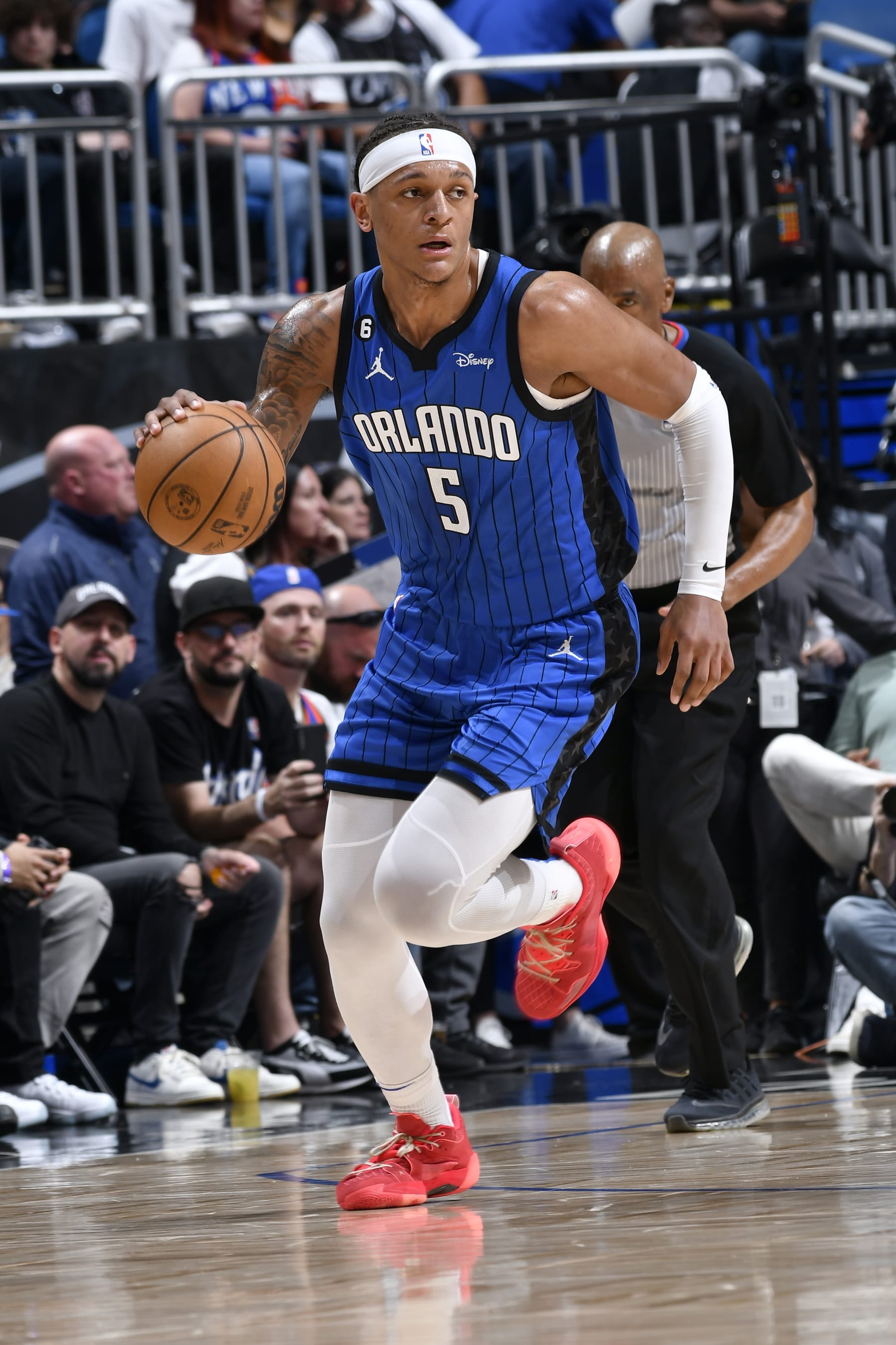 ORLANDO, FL - MARCH 23: Paolo Banchero #5 of the Orlando Magic dribbles the ball during the game against the New York Knicks on March 23, 2023 at Amway Center in Orlando, Florida. NOTE TO USER: User expressly acknowledges and agrees that, by downloading and or using this photograph, User is consenting to the terms and conditions of the Getty Images License Agreement. Mandatory Copyright Notice: Copyright 2023 NBAE (Photo by Fernando Medina/NBAE via Getty Images)