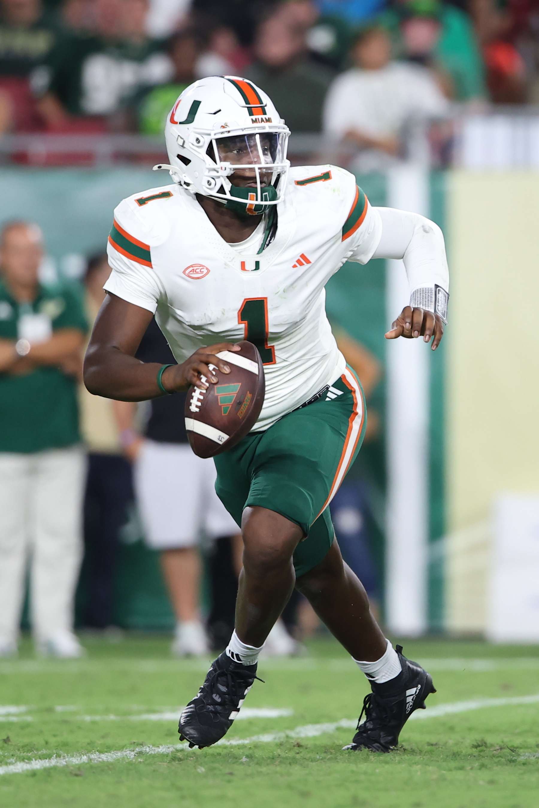 TAMPA, FL - SEPTEMBER 21: Miami Hurricanes quarterback Cam Ward (1) scrambles for time during the game between the University of Miami Hurricanes and the South Florida Bulls on Saturday, September 21, 2024 at Raymond James Stadium in Tampa, Fla. (Photo by Peter Joneleit/Icon Sportswire via Getty Images)