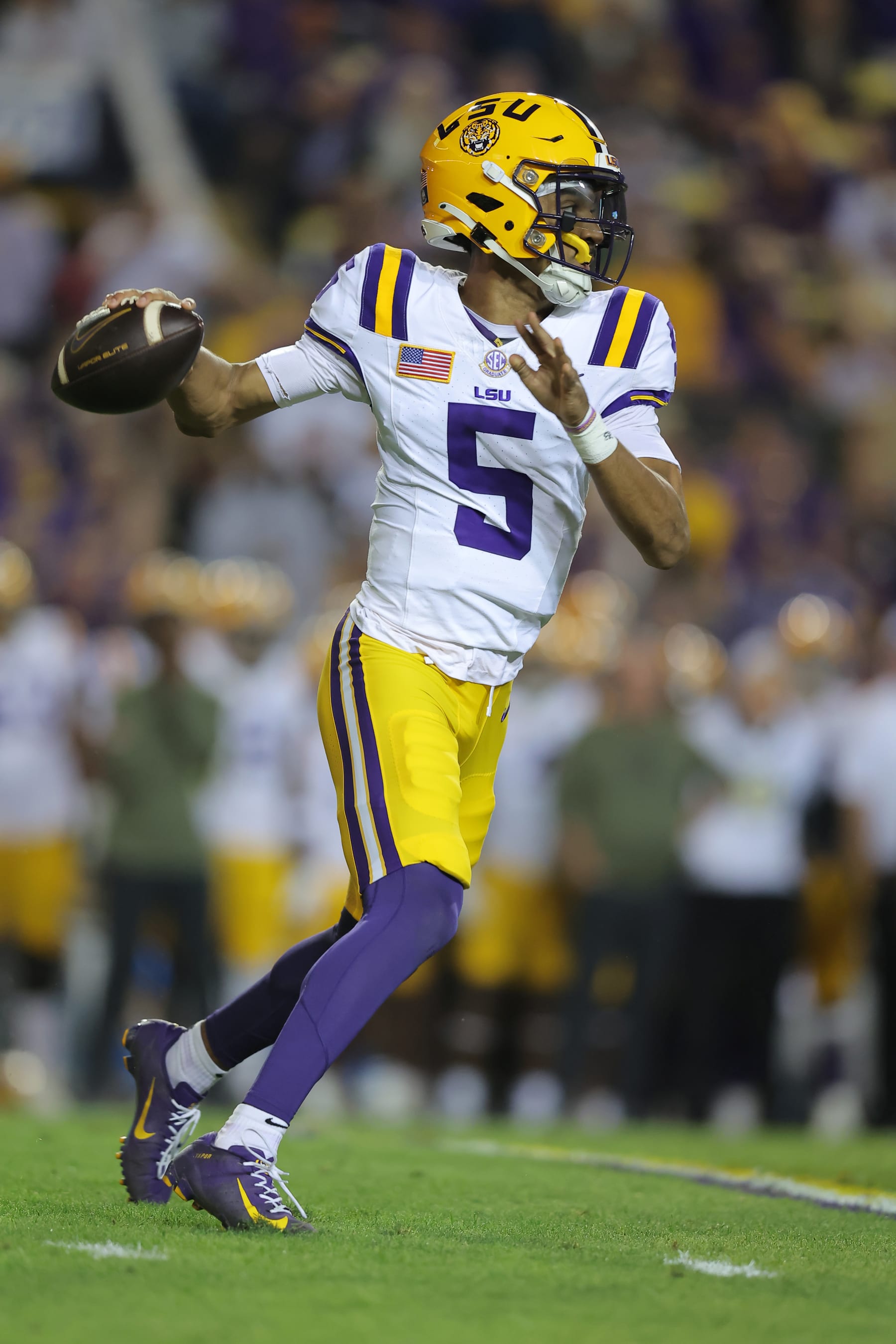 BATON ROUGE, LOUISIANA - NOVEMBER 11: Jayden Daniels #5 of the LSU Tigers throws the ball against the Florida Gators during a game at Tiger Stadium on November 11, 2023 in Baton Rouge, Louisiana. (Photo by Jonathan Bachman/Getty Images)