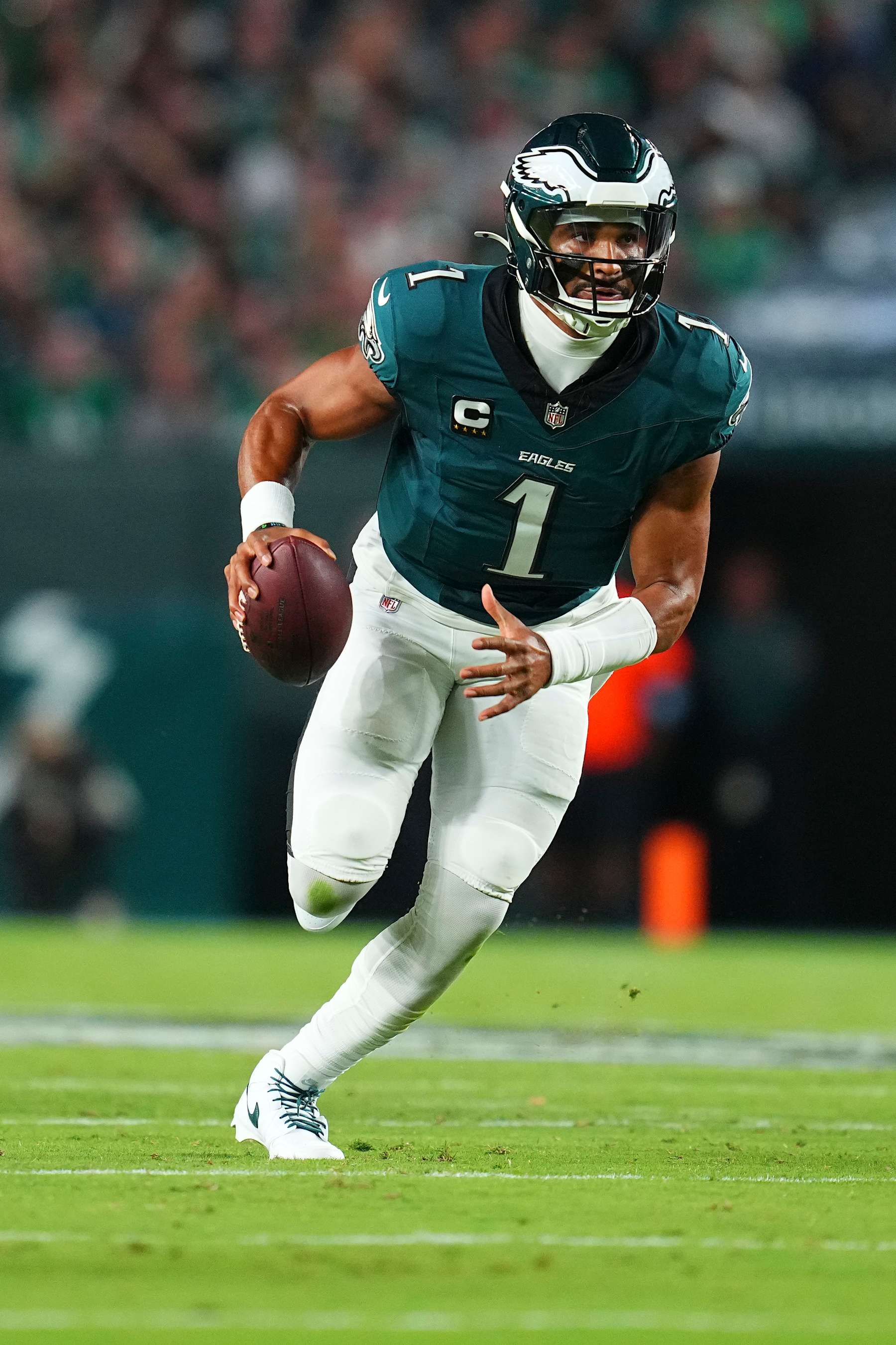 PHILADELPHIA, PENNSYLVANIA - SEPTEMBER 16: Jalen Hurts #1 of the Philadelphia Eagles scrambles with the ball against the Atlanta Falcons at Lincoln Financial Field on September 16, 2024 in Philadelphia, Pennsylvania. (Photo by Mitchell Leff/Getty Images)
