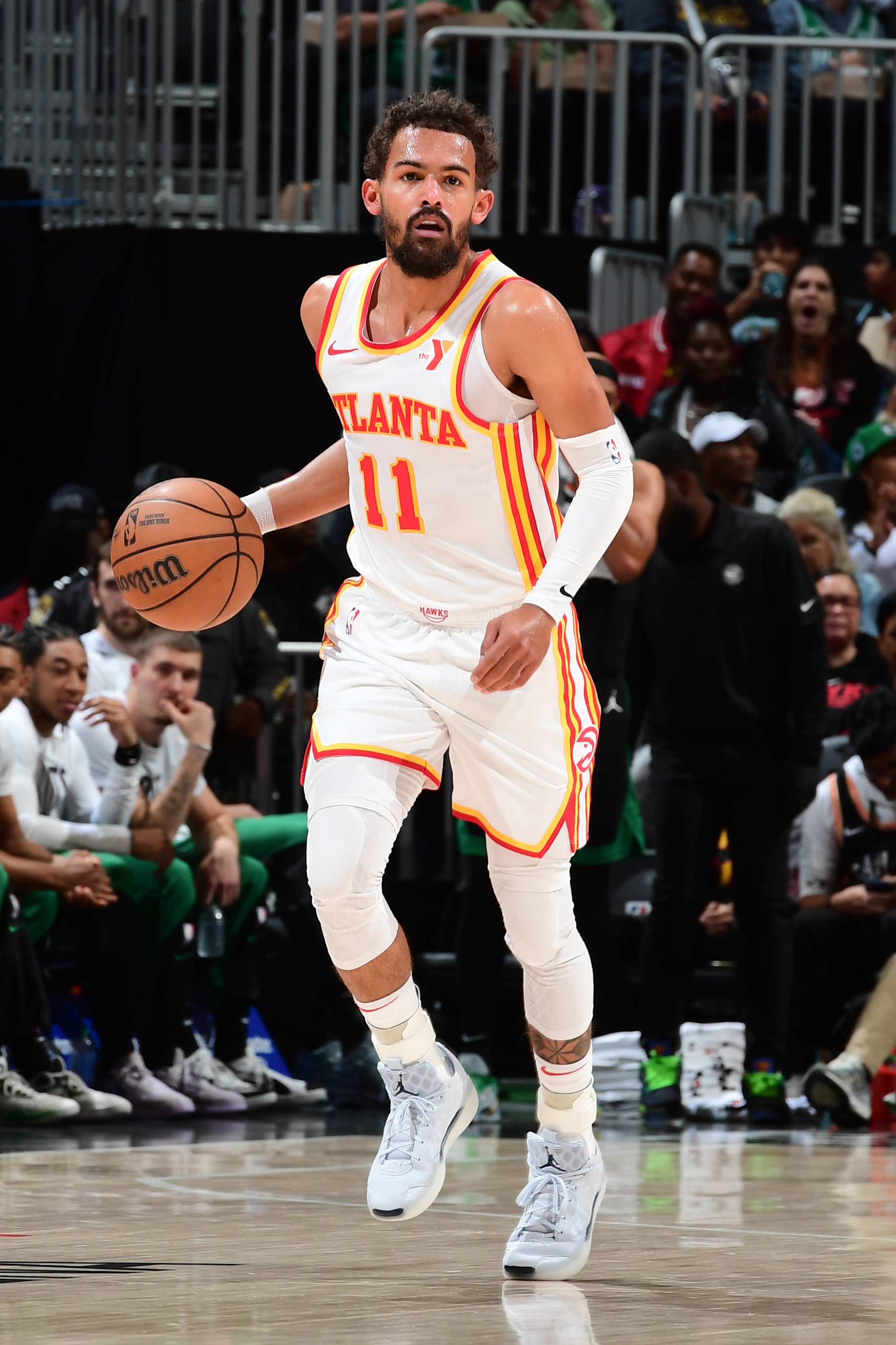 ATLANTA, GA - NOVEMBER 4: Trae Young #11 of the Atlanta Hawks dribbles the ball during the game against the Boston Celtics on November 4, 2024 at State Farm Arena in Atlanta, Georgia.  NOTE TO USER: User expressly acknowledges and agrees that, by downloading and/or using this Photograph, user is consenting to the terms and conditions of the Getty Images License Agreement. Mandatory Copyright Notice: Copyright 2024 NBAE (Photo by Scott Cunningham/NBAE via Getty Images)