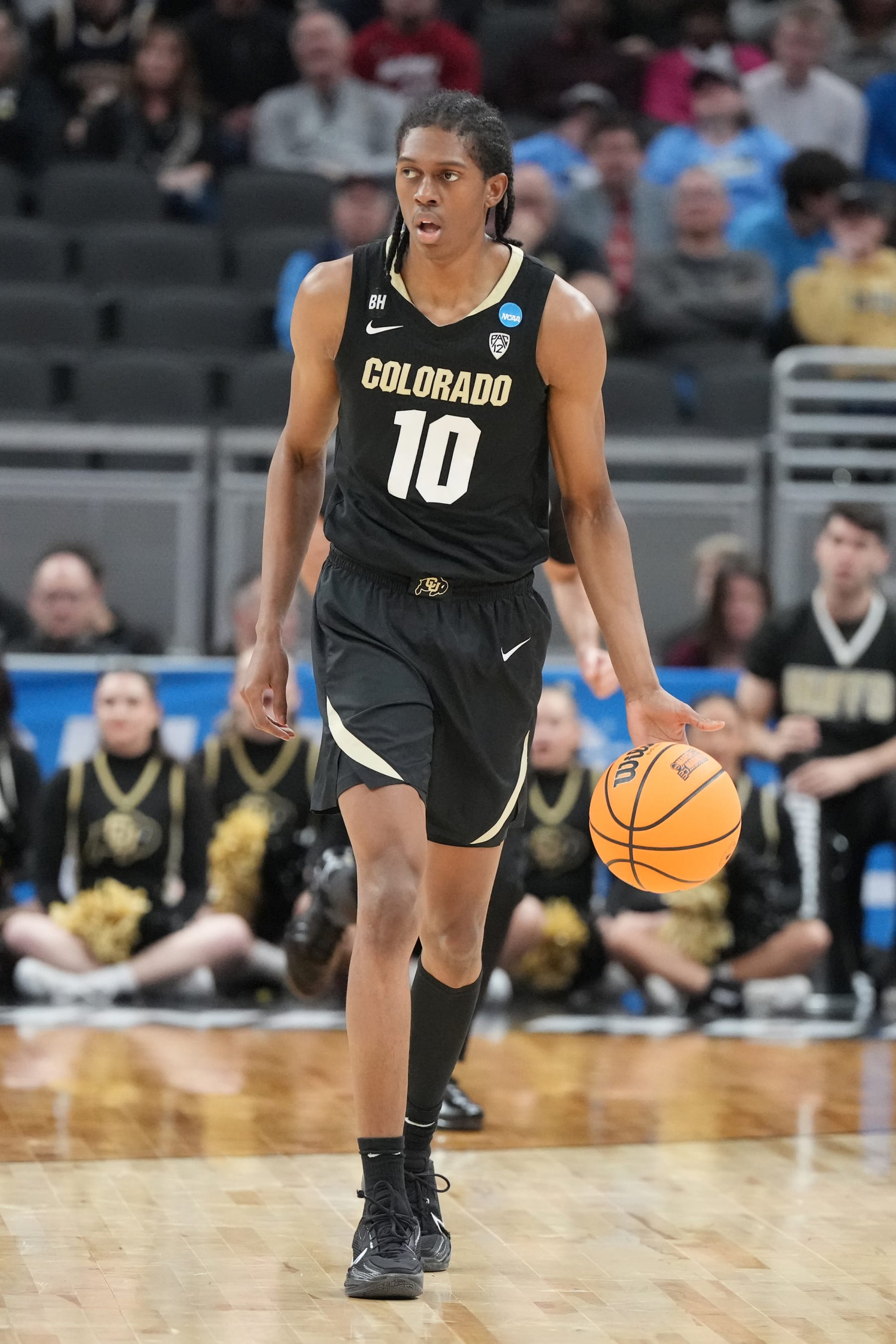 INDIANAPOLIS, INDIANA - MARCH 24: Cody Williams #10 of the Colorado Buffaloes dribbles the ball during the Second Round NCAA Men's Basketball Tournament game against the Marquette Golden Eagles at Gainbridge Fieldhouse on March 24, 2024 in Indianapolis, Indiana. (Photo by Mitchell Layton/Getty Images)
