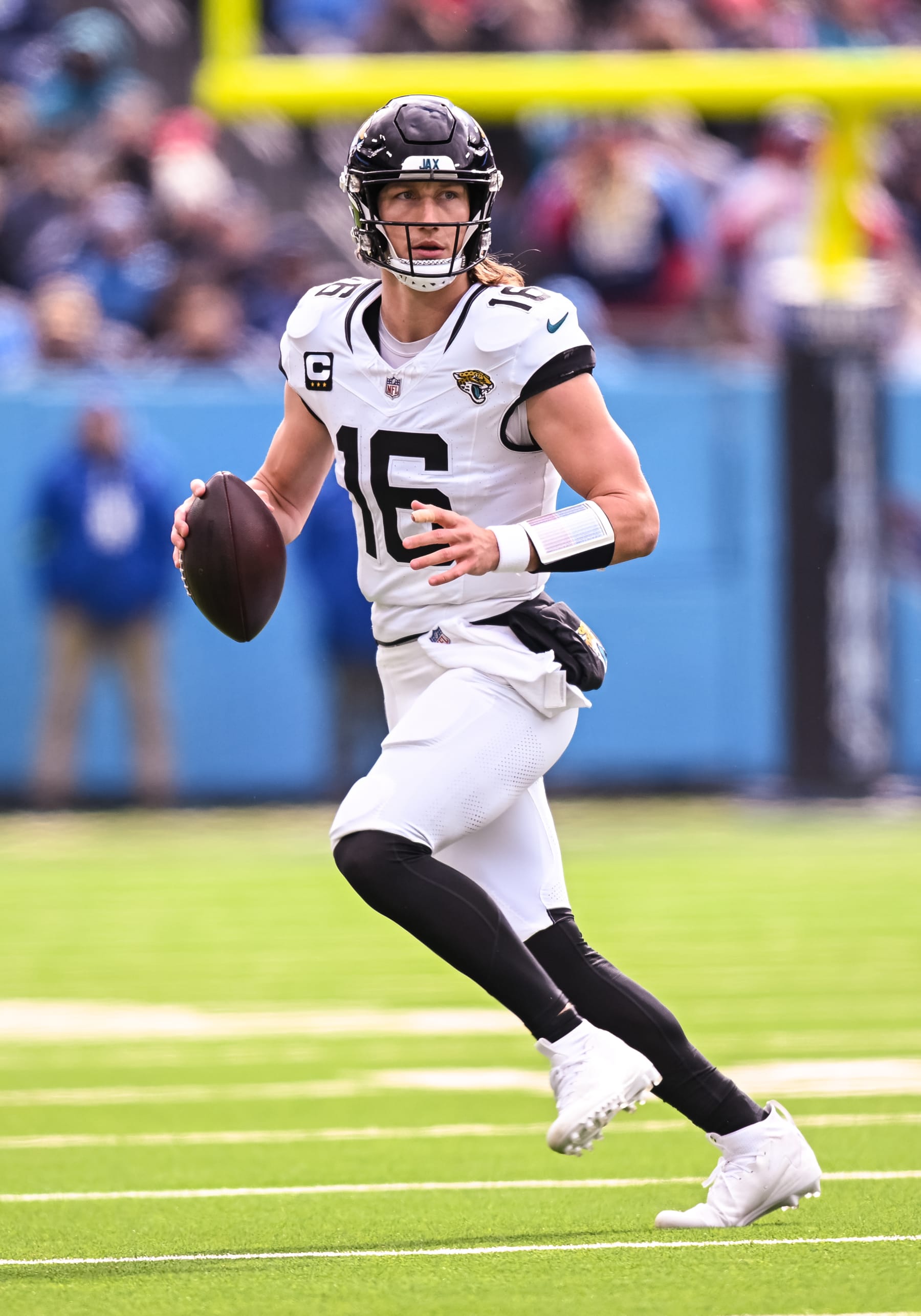 NASHVILLE, TN - JANUARY 07: Jacksonville Jaguars quarterback Trevor Lawrence (16) runs with the ball during the NFL game between the Tennessee Titans and the Jacksonville Jaguars on January 7, 2024, at Nissan Stadium in Nashville, TN. (Photo by Bryan Lynn/Icon Sportswire via Getty Images)