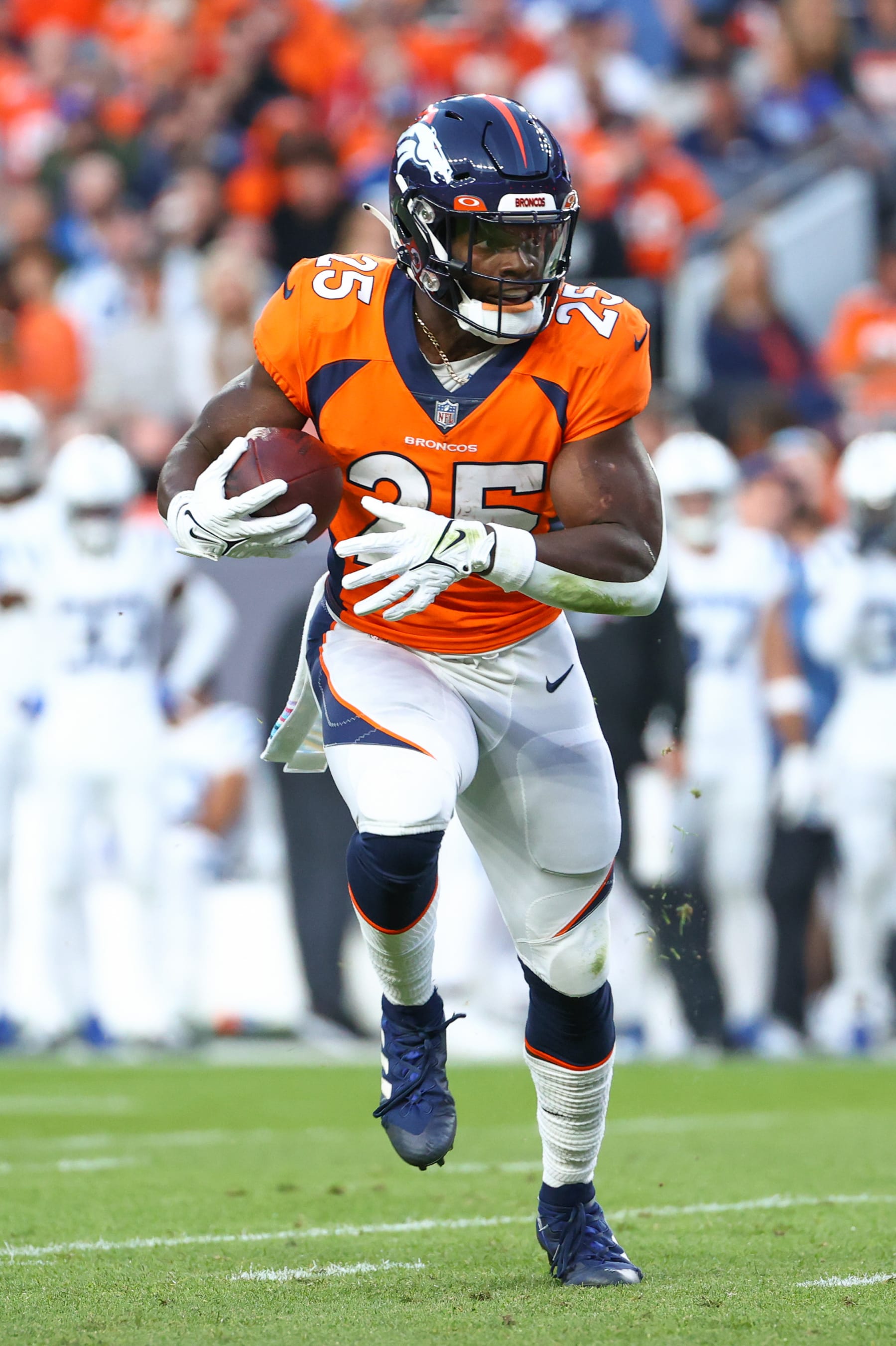 DENVER, CO - OCTOBER 06: Melvin Gordon III #25 of the Denver Broncos runs the ball against the Indianapolis Colts during the first quarter at Empower Field At Mile High on October 6, 2022 in Denver, Colorado. (Photo by Justin Tafoya/Getty Images)