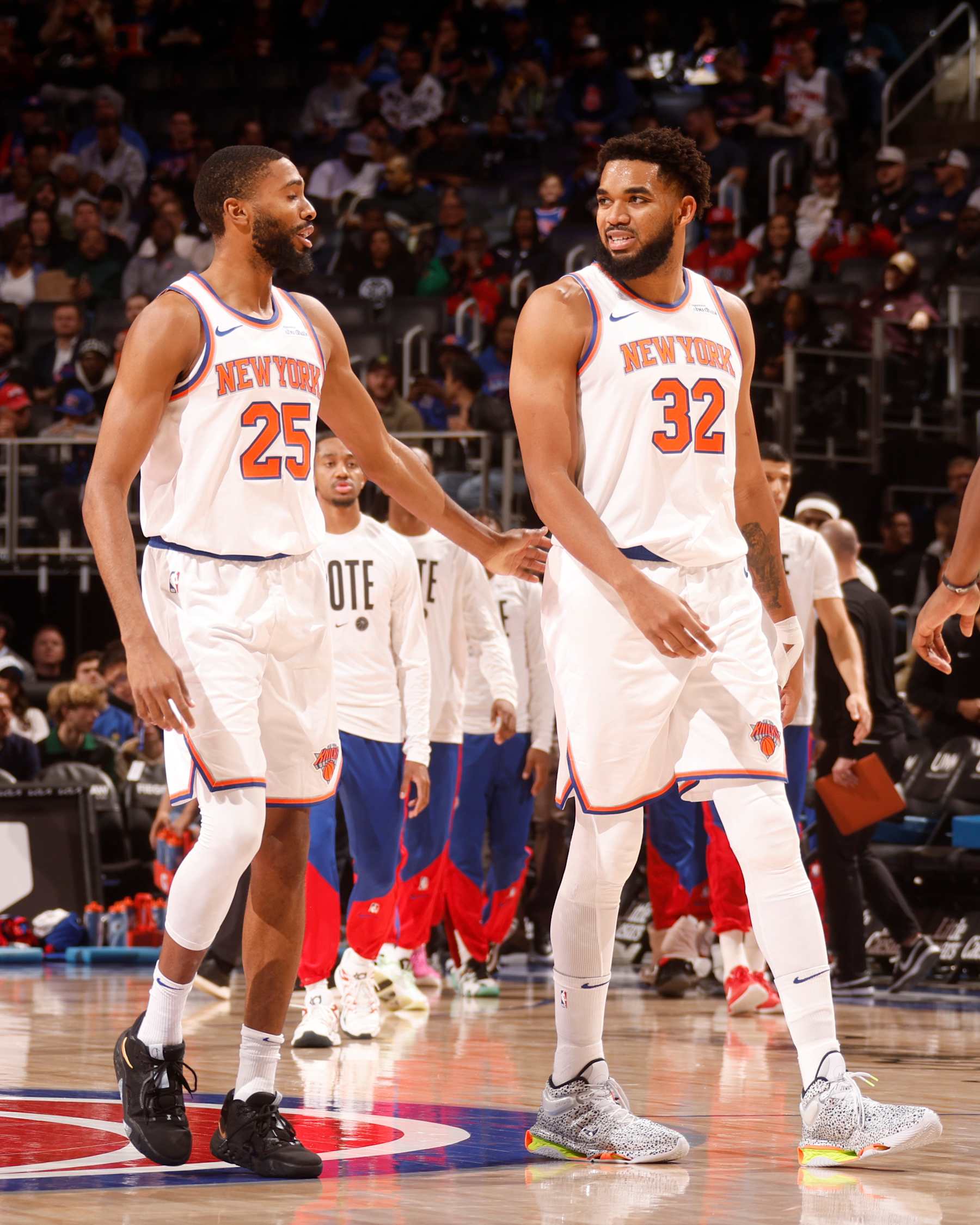 DETROIT, MI - NOVEMBER 1: Mikal Bridges #25 and Karl-Anthony Towns #32 of the New York Knicks talk during the game against the Detroit Pistons on November 1, 2024 at Little Caesars Arena in Detroit, Michigan. NOTE TO USER: User expressly acknowledges and agrees that, by downloading and/or using this photograph, User is consenting to the terms and conditions of the Getty Images License Agreement. Mandatory Copyright Notice: Copyright 2024 NBAE (Photo by Brian Sevald/NBAE via Getty Images)