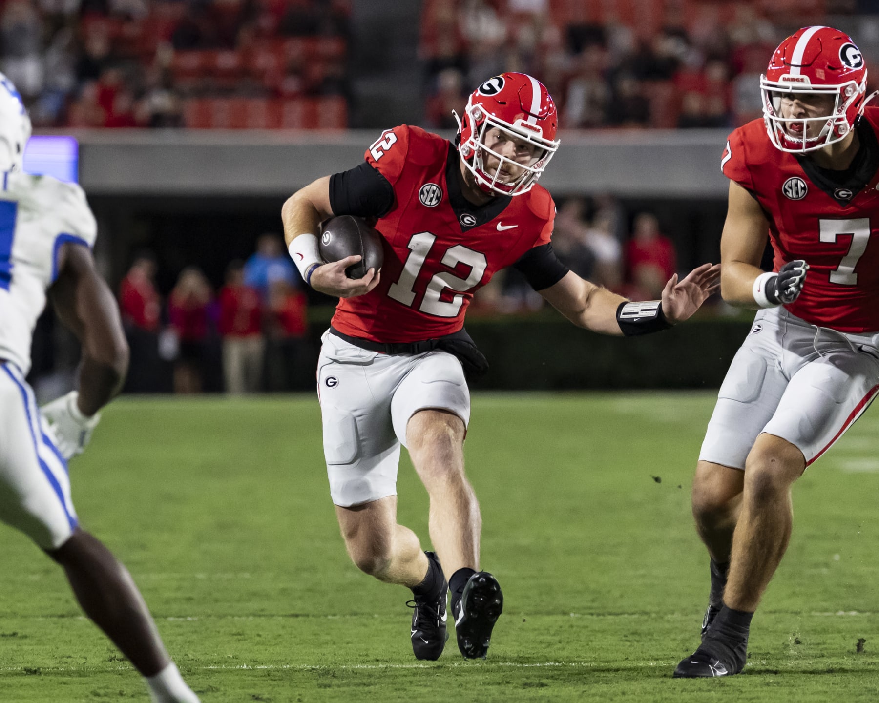 ATHENS, GA - OCTOBER 7: Brock Vandagriff #12 of the Georgia Bulldogs runs with the ball during a game between University of Kentucky and University of Georgia at Sanford Stadium on October 7, 2023 in Athens, Georgia. (Photo by Steve Limentani/ISI Photos/Getty Images)