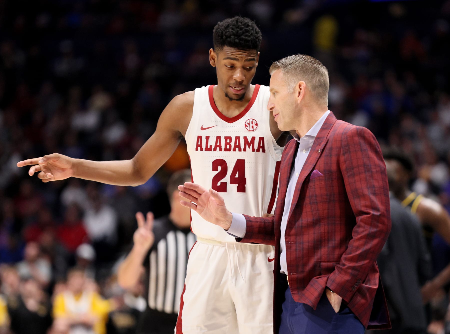 NASHVILLE, TENNESSEE - MARCH 11: Brandon Miller #24 of the Alabama Crimson Tide talks with head coach Nate Oats during the second half against the Missouri Tigers during the SEC Basketball Tournament Semifinals at Bridgestone Arena on March 11, 2023 in Nashville, Tennessee. (Photo by Andy Lyons/Getty Images)