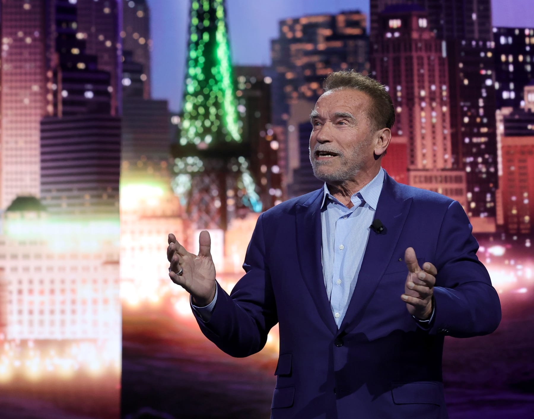 LAS VEGAS, NEVADA - JANUARY 04: Actor Arnold Schwarzenegger speaks during a keynote address by Chairman of the Board of Management of BMW AG Oliver Zipse at CES 2023 at The Pearl concert theater at Palms Casino Resort on January 04, 2023 in Las Vegas, Nevada. CES, the world's largest annual consumer technology trade show, runs from January 5-8 and features about 3,100 exhibitors showing off their latest products and services to more than 100,000 attendees. (Photo by Ethan Miller/Getty Images)