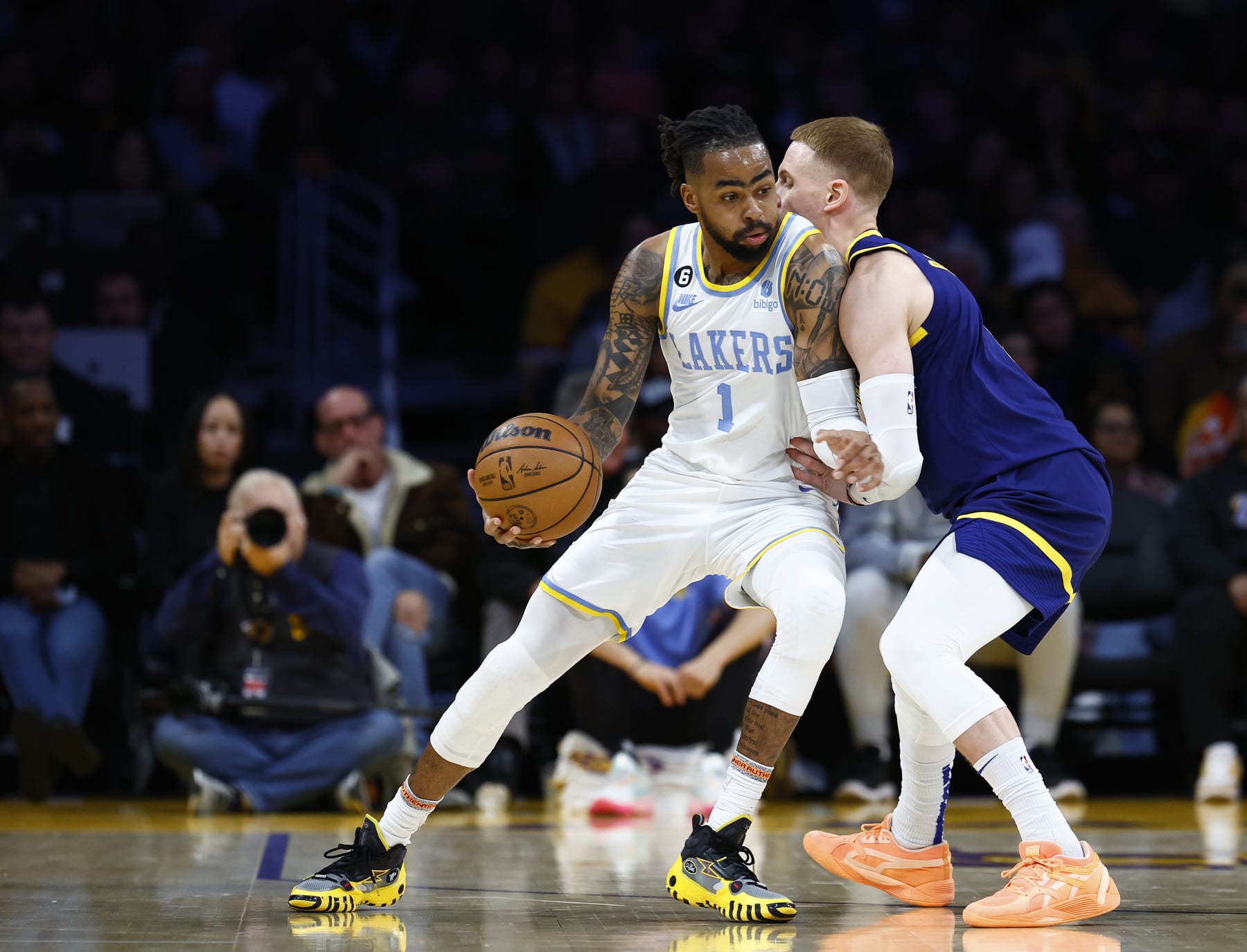 LOS ANGELES, CALIFORNIA - FEBRUARY 23:  D'Angelo Russell #1 of the Los Angeles Lakers controls the ball against Donte DiVincenzo #0 of the Golden State Warriors in the first half at Crypto.com Arena on February 23, 2023 in Los Angeles, California.  NOTE TO USER: User expressly acknowledges and agrees that, by downloading and/or using this photograph, user is consenting to the terms and conditions of the Getty Images License Agreement.  (Photo by Ronald Martinez/Getty Images)