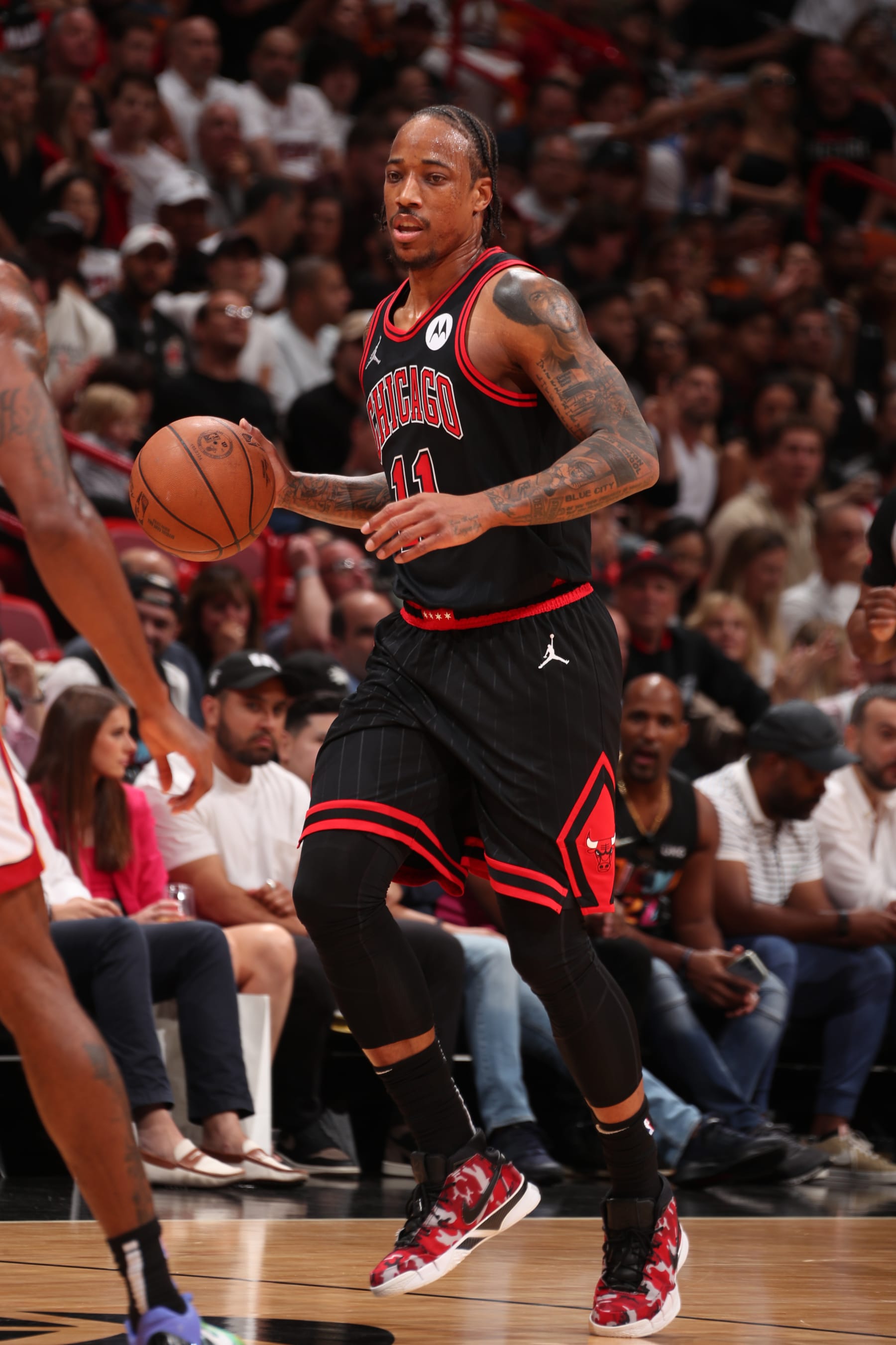 MIAMI, FL - APRIL 19: DeMar DeRozan #11 of the Chicago Bulls dribbles the ball during the game against the Miami Heat during the 2024 Play-In Tournament on April 19, 2024 at Kaseya Center in Miami, Florida. NOTE TO USER: User expressly acknowledges and agrees that, by downloading and or using this Photograph, user is consenting to the terms and conditions of the Getty Images License Agreement. Mandatory Copyright Notice: Copyright 2024 NBAE (Photo by Issac Baldizon/NBAE via Getty Images)