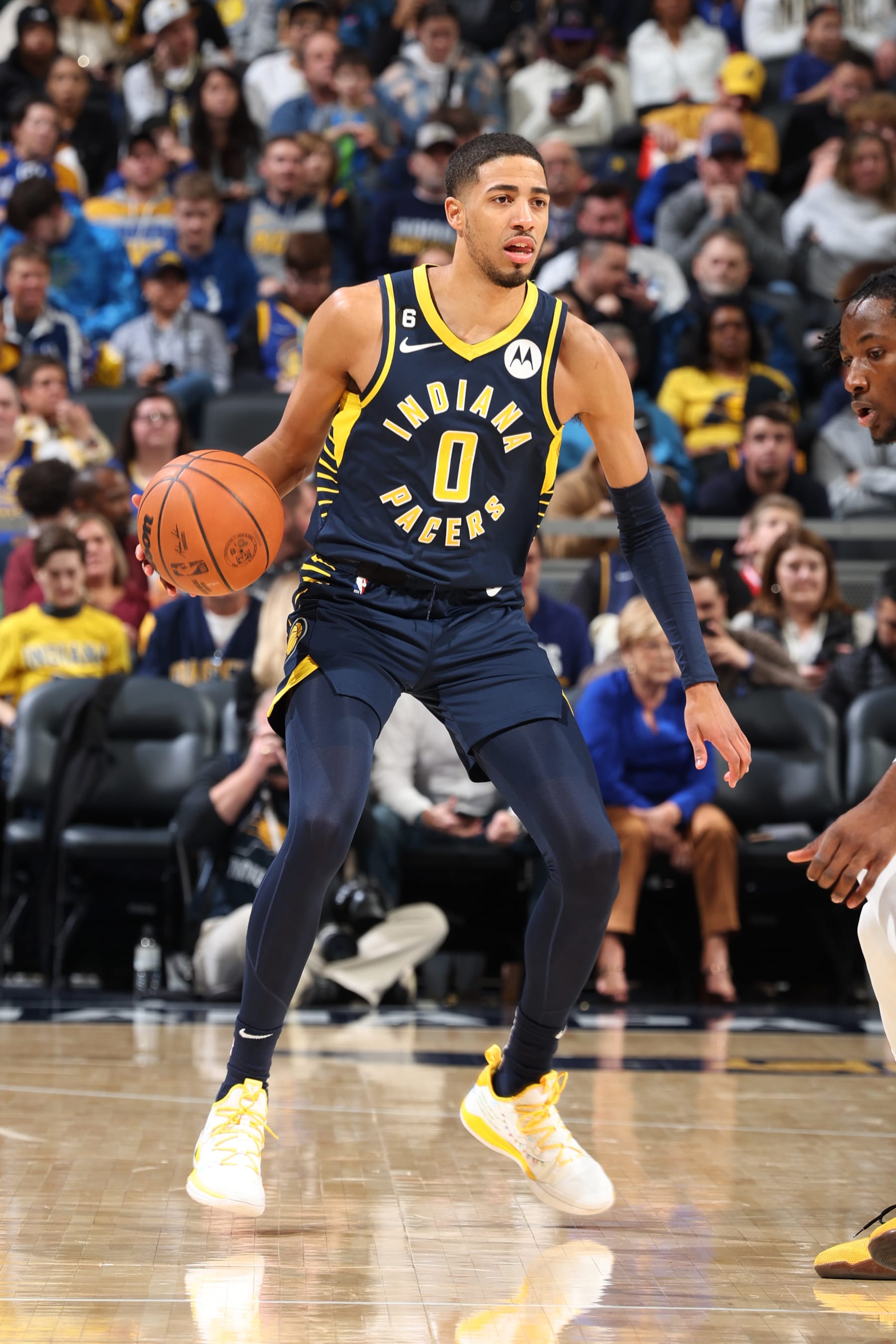 INDIANAPOLIS, IN - DECEMBER 14: Tyrese Haliburton #0 of the Indiana Pacers dribbles the ball during the game against the Golden State Warriors on December 14, 2022 at Gainbridge Fieldhouse in Indianapolis, Indiana. NOTE TO USER: User expressly acknowledges and agrees that, by downloading and or using this photograph, User is consenting to the terms and conditions of the Getty Images License Agreement. Mandatory Copyright Notice: Copyright 2022 NBAE (Photo by Jeff Haynes/NBAE via Getty Images)
