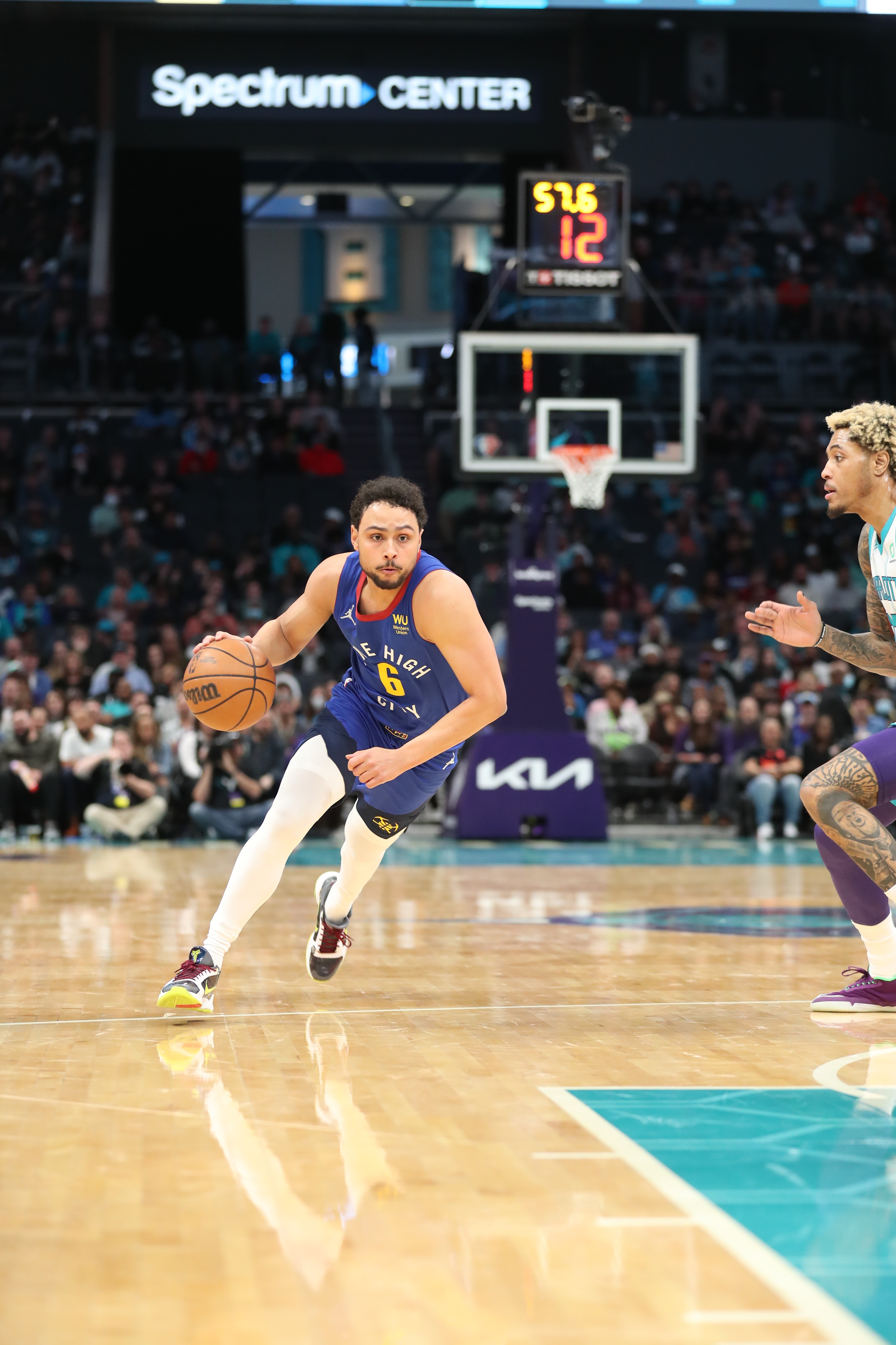CHARLOTTE, NC - MARCH 28: Bryn Forbes #6 of the Denver Nuggets drives to the basket during the game against the Charlotte Hornets on March 28, 2022 at Spectrum Center in Charlotte, North Carolina. NOTE TO USER: User expressly acknowledges and agrees that, by downloading and or using this photograph, User is consenting to the terms and conditions of the Getty Images License Agreement.  Mandatory Copyright Notice:  Copyright 2022 NBAE (Photo by Brock Williams-Smith/NBAE via Getty Images)