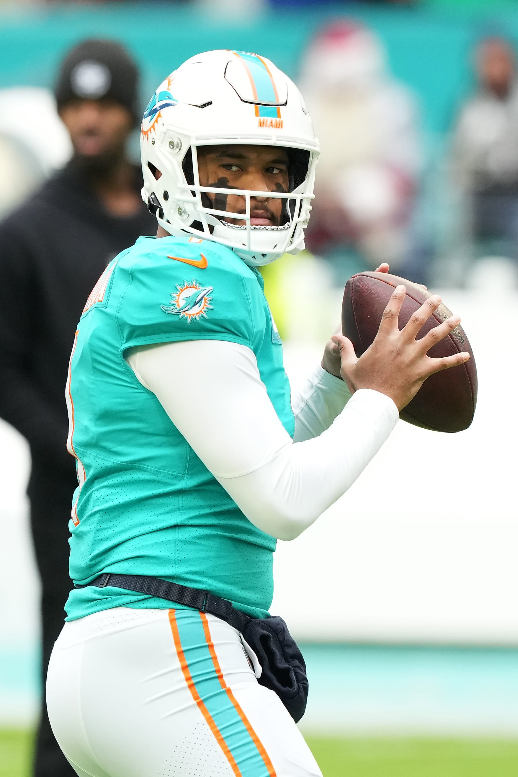 MIAMI GARDENS, FLORIDA - DECEMBER 25: Tua Tagovailoa #1 of the Miami Dolphins warms up before the game against the Green Bay Packers at Hard Rock Stadium on December 25, 2022 in Miami Gardens, Florida. (Photo by Eric Espada/Getty Images)