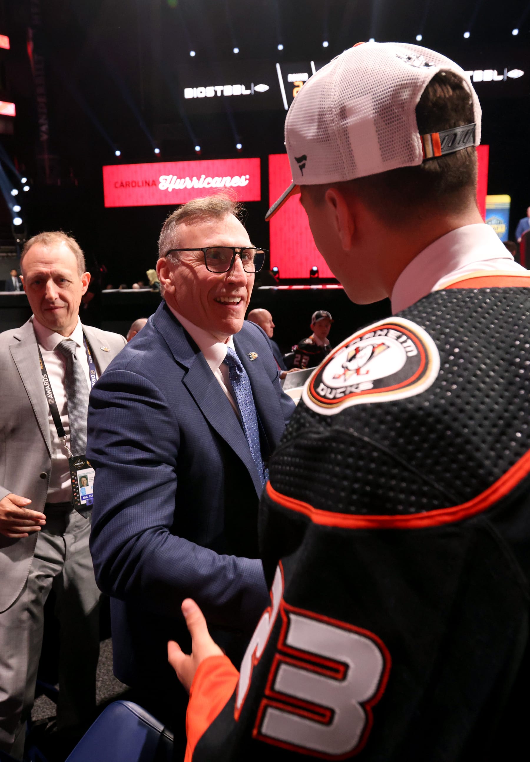 NASHVILLE, TENNESSEE - JUNE 29: Carey Terrance (R) shakes hands with general manager Pat Verbeek stage after being selected 59th overall by the Anaheim Ducks during the 2023 Upper Deck NHL Draft at Bridgestone Arena on June 29, 2023 in Nashville, Tennessee. (Photo by Dave Sandford/NHLI via Getty Images)