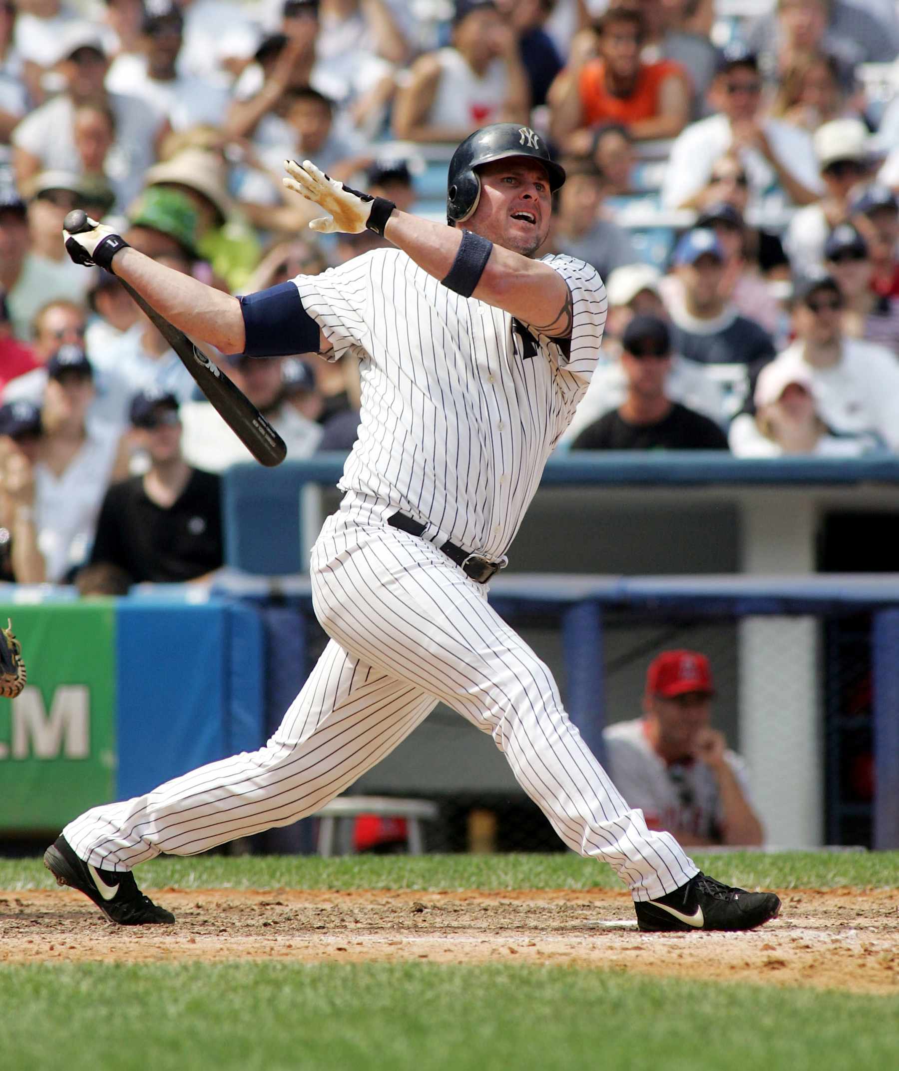 NEW YORK - JULY 31: Jason Giambi #25 of the New York Yankees hits his 300th career home run in the seventh inning against the Los Angeles Angels of Anaheim on July 31, 2005 at Yankee Stadium in the Bronx borough of New York City. (Photo by Jim McIsaac/Getty Images)    