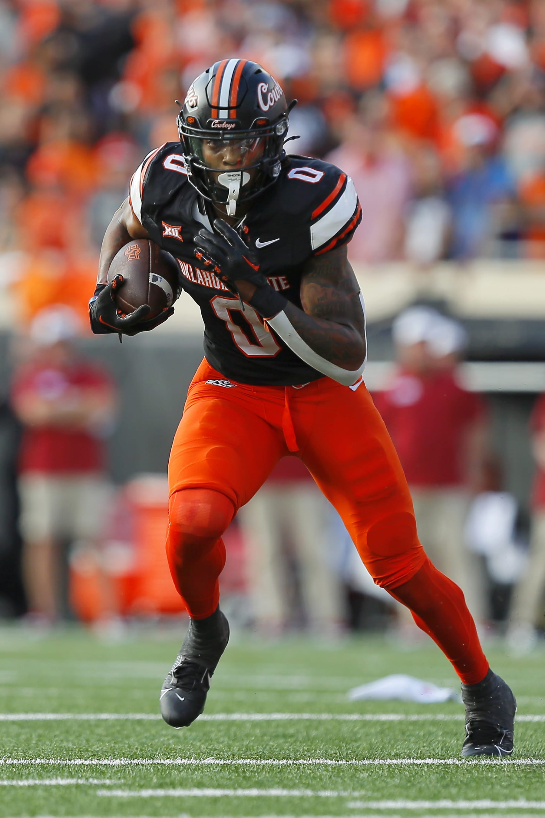 STILLWATER, OK - NOVEMBER 4:  Running back Ollie Gordon II #0 of the Oklahoma State Cowboys carries the ball against the Oklahoma Sooners in the third quarter of Bedlam at Boone Pickens Stadium on November 4, 2023 in Stillwater, Oklahoma.  Oklahoma State won 27-24.  (Photo by Brian Bahr/Getty Images)