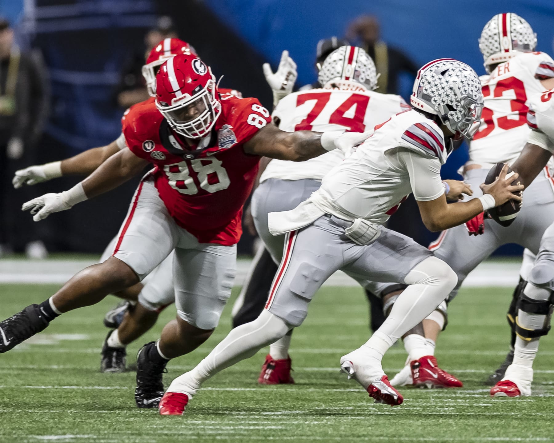 Georgia defensive lineman Jalen Carter chases Ohio State quarterback C.J. Stroud during the Peach Bowl. 