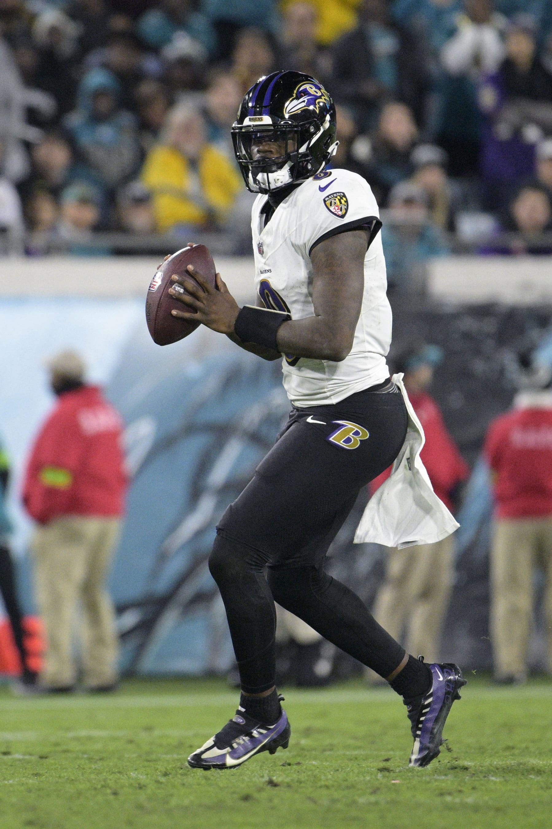 Baltimore Ravens quarterback Lamar Jackson (8) looks for a receiver during the first half of an NFL football game against the Jacksonville Jaguars, Sunday, Dec. 17, 2023, in Jacksonville, Fla. (AP Photo/Phelan M. Ebenhack)