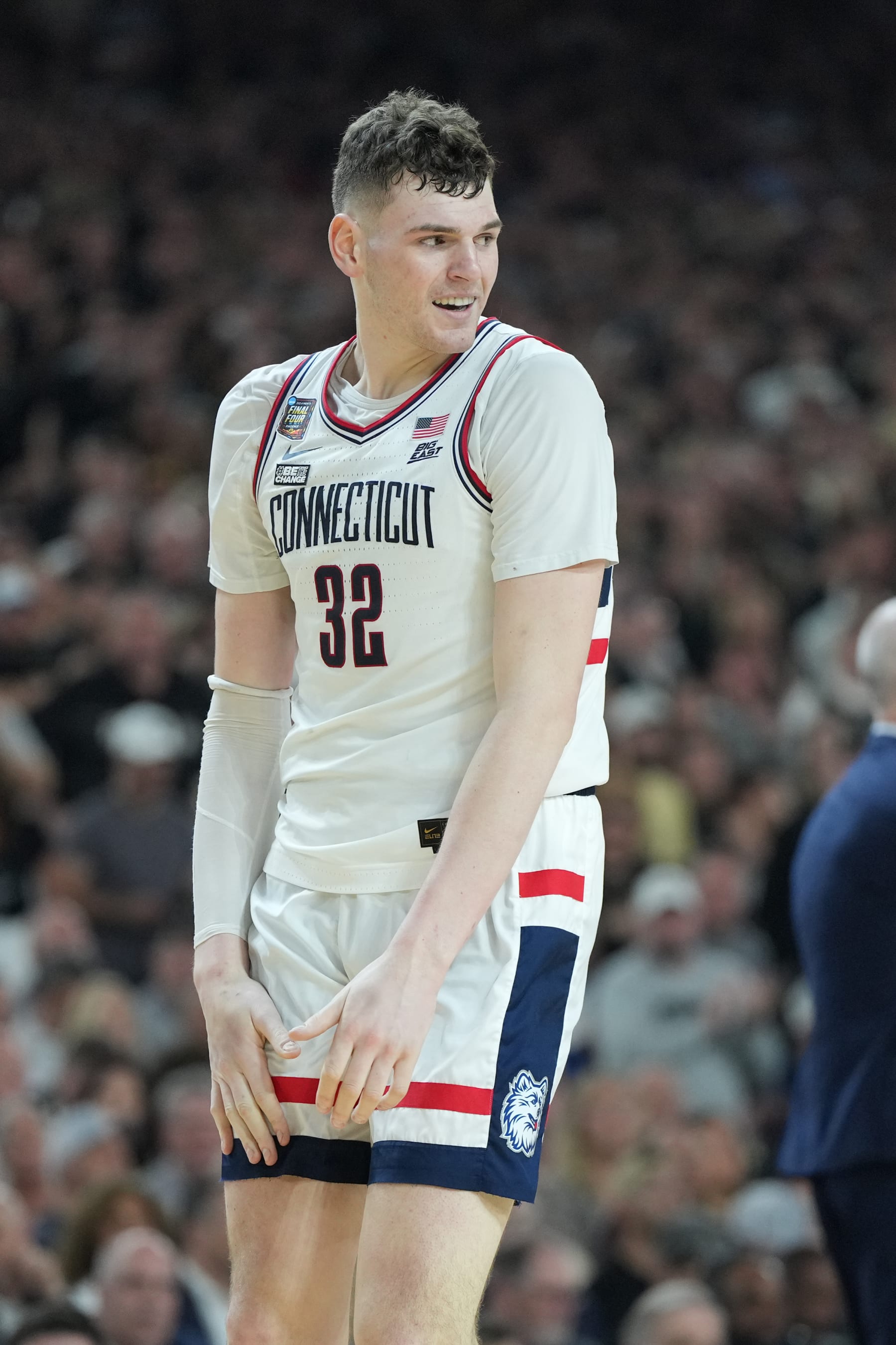 GLENDALE, ARIZONA - APRIL 08:  Donovan Clingan #32 of the Connecticut Huskies looks on during the National College Basketball Championship game against the Purdue Boilermakers at State Farm Stadium on April 08, 2024 in Glendale, Arizona.  (Photo by Mitchell Layton/Getty Images)