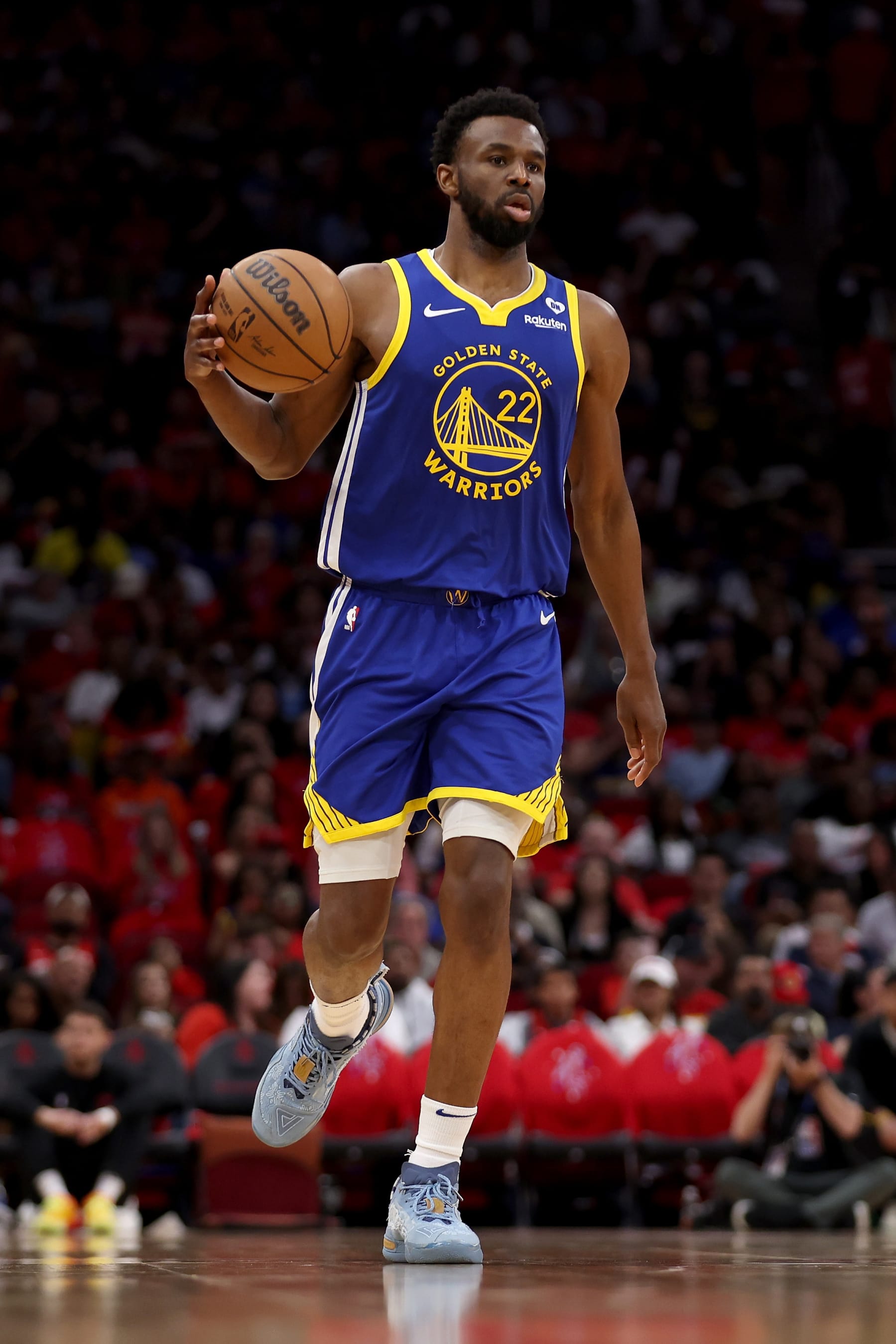 HOUSTON, TEXAS - APRIL 04: Andrew Wiggins #22 of the Golden State Warriors brings the ball up court in the second half against the Houston Rockets at Toyota Center on April 04, 2024 in Houston, Texas.  NOTE TO USER: User expressly acknowledges and agrees that, by downloading and or using this photograph, User is consenting to the terms and conditions of the Getty Images License Agreement. (Photo by Tim Warner/Getty Images)