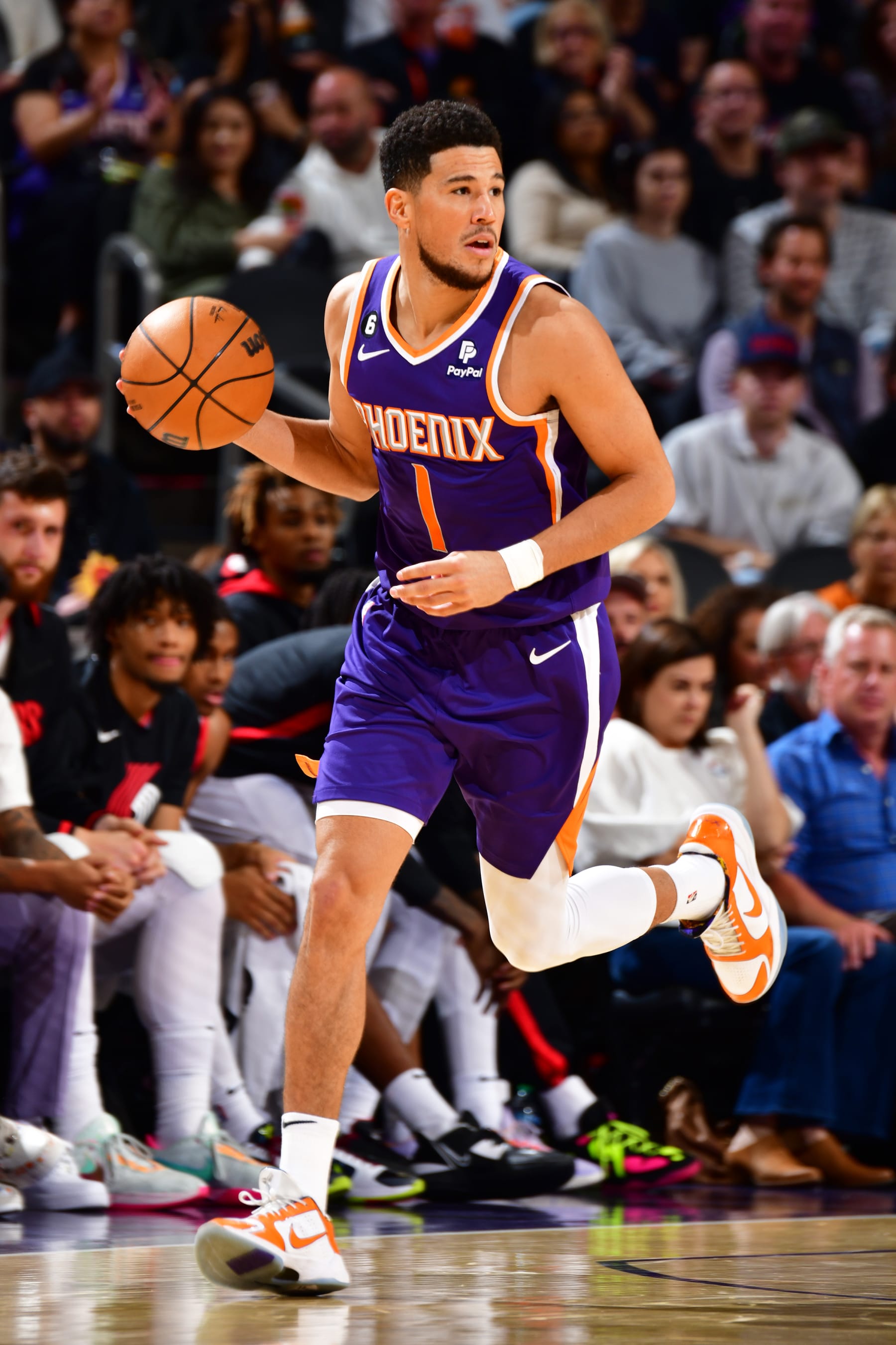 PHOENIX, AZ - NOVEMBER 5: Devin Booker #1 of the Phoenix Suns handles the ball during the game against the Portland Trail Blazers on November 5, 2022 at Footprint Center in Phoenix, Arizona. NOTE TO USER: User expressly acknowledges and agrees that, by downloading and or using this photograph, user is consenting to the terms and conditions of the Getty Images License Agreement. Mandatory Copyright Notice: Copyright 2022 NBAE (Photo by Barry Gossage/NBAE via Getty Images)
