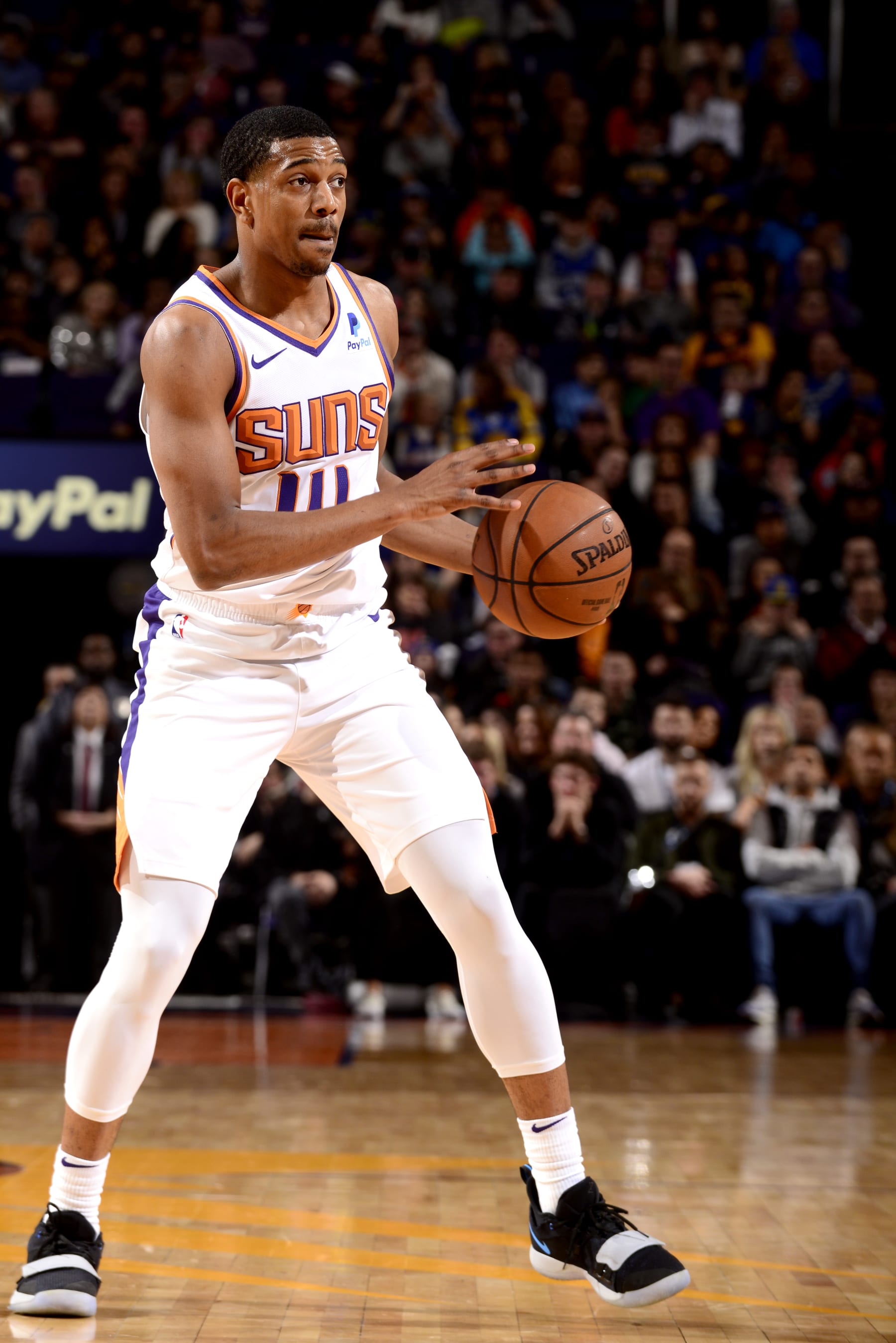 PHOENIX, AZ - DECEMBER 31: De'Anthony Melton #14 of the Phoenix Suns handles the ball against the Golden State Warriors on December 31, 2018 at Talking Stick Resort Arena in Phoenix, Arizona. NOTE TO USER: User expressly acknowledges and agrees that, by downloading and or using this photograph, user is consenting to the terms and conditions of the Getty Images License Agreement. Mandatory Copyright Notice: Copyright 2018 NBAE (Photo by Barry Gossage/NBAE via Getty Images)