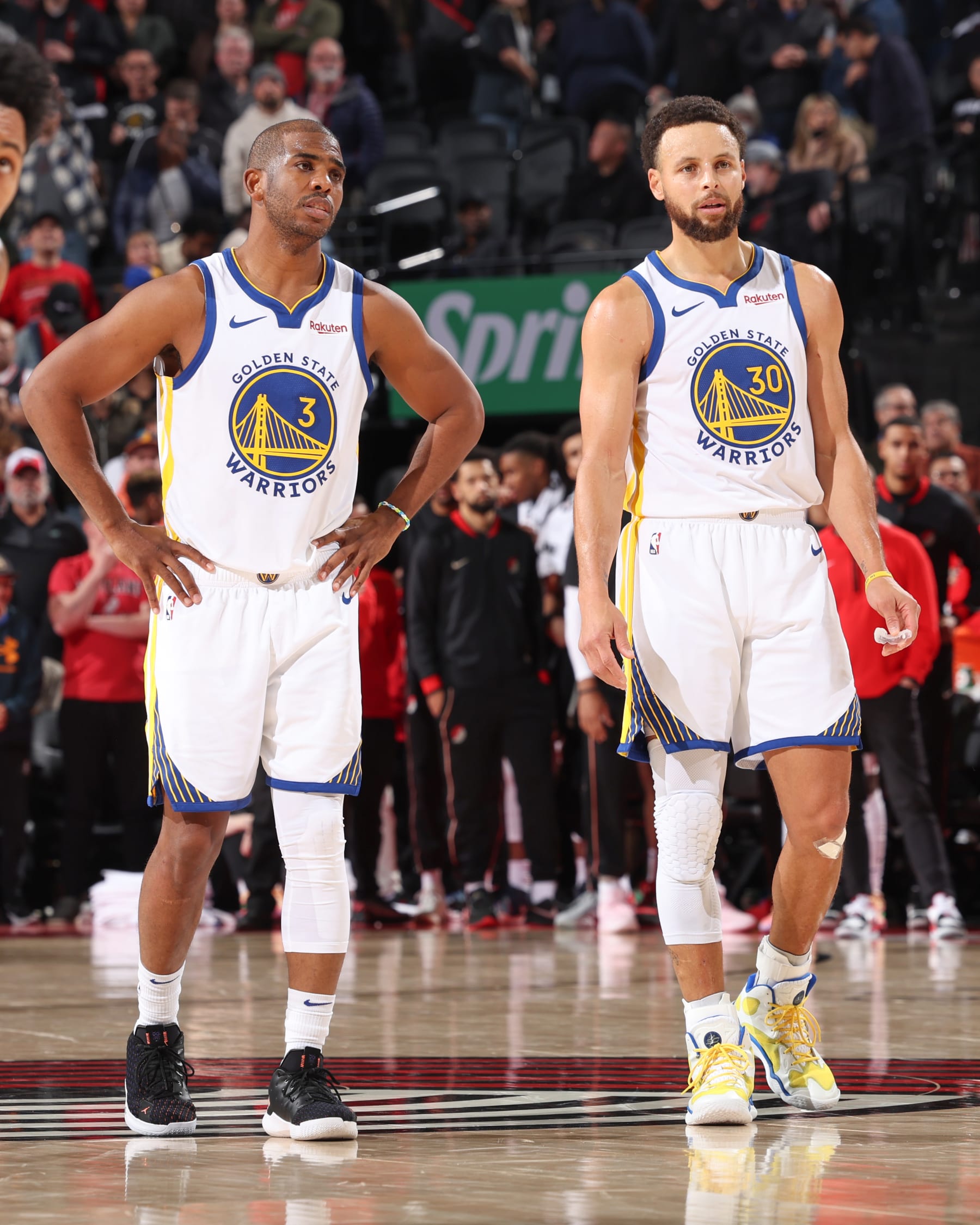 PORTLAND, OR - DECEMBER 17:  Chris Paul #3 of the Golden State Warriors & Stephen Curry #30 of the Golden State Warriors looks on during the game on December 17, 2023 at the Moda Center Arena in Portland, Oregon. NOTE TO USER: User expressly acknowledges and agrees that, by downloading and or using this photograph, user is consenting to the terms and conditions of the Getty Images License Agreement. Mandatory Copyright Notice: Copyright 2023 NBAE (Photo by David Sherman/NBAE via Getty Images)