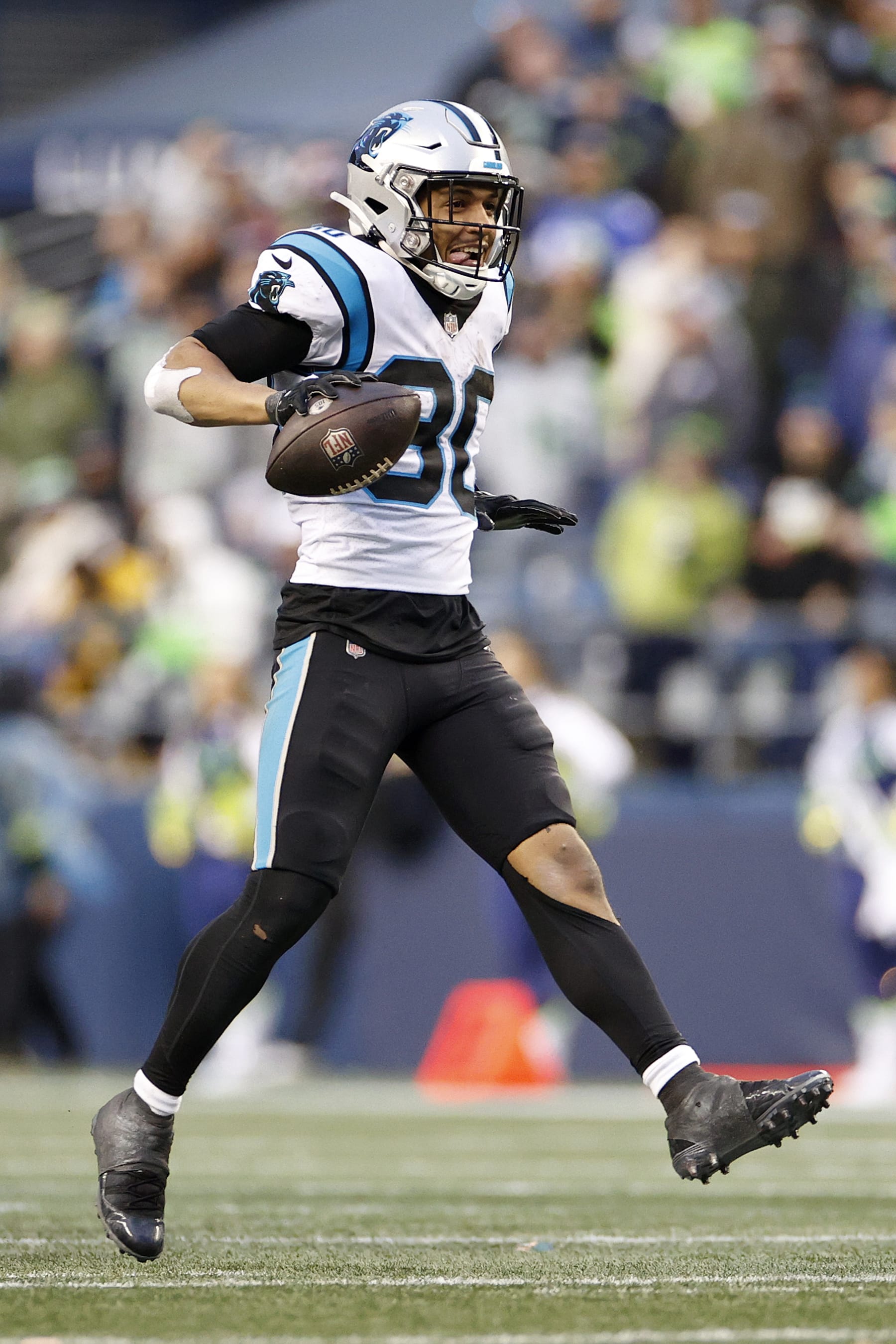 SEATTLE, WASHINGTON - DECEMBER 11: Chuba Hubbard #30 of the Carolina Panthers reacts after a gain against the Seattle Seahawks during the fourth quarter at Lumen Field on December 11, 2022 in Seattle, Washington. (Photo by Steph Chambers/Getty Images)