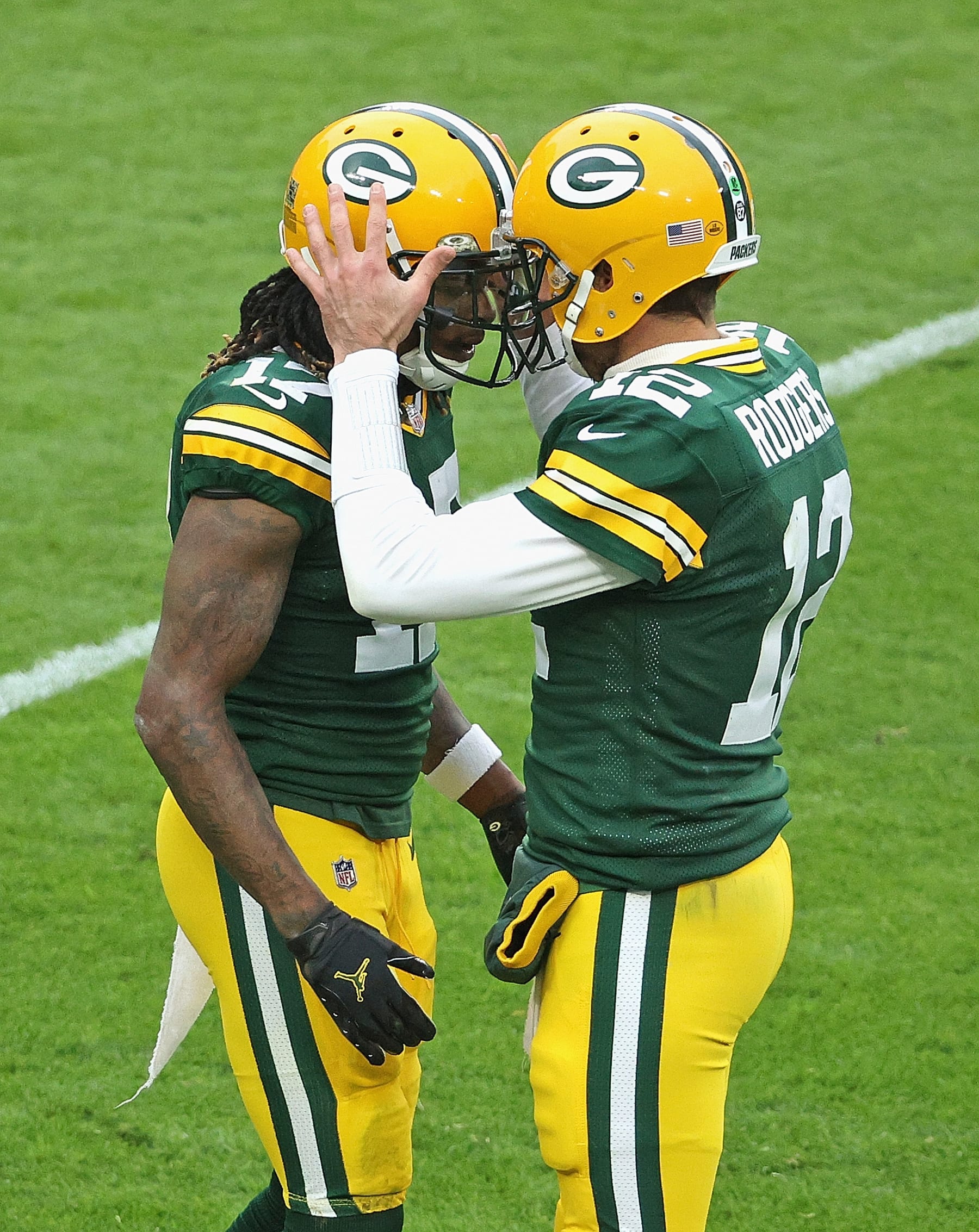 GREEN BAY, WISCONSIN - NOVEMBER 15: Davante Adams #17 (L) and Aaron Rodgers #12 of the Green Bay Packers celebrate a touchdown against the Jacksonville Jaguars at Lambeau Field on November 15, 2020 in Green Bay, Wisconsin. (Photo by Dylan Buell/Getty Images)