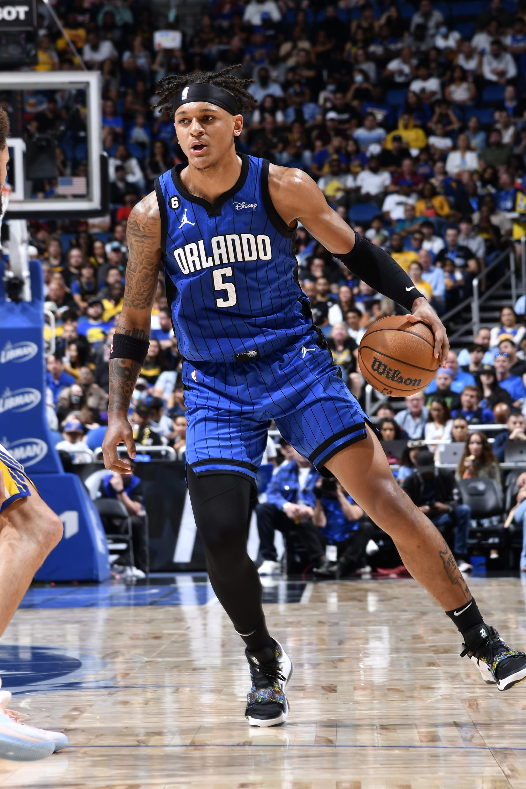 ORLANDO, FL - NOVEMBER 2: Paolo Banchero #5 of the Orlando Magic handles the ball during the game against the Golden State Warriors on November 2, 2022 at Amway Center in Orlando, Florida. NOTE TO USER: User expressly acknowledges and agrees that, by downloading and or using this photograph, User is consenting to the terms and conditions of the Getty Images License Agreement. Mandatory Copyright Notice: Copyright 2022 NBAE (Photo by Fernando Medina/NBAE via Getty Images)
