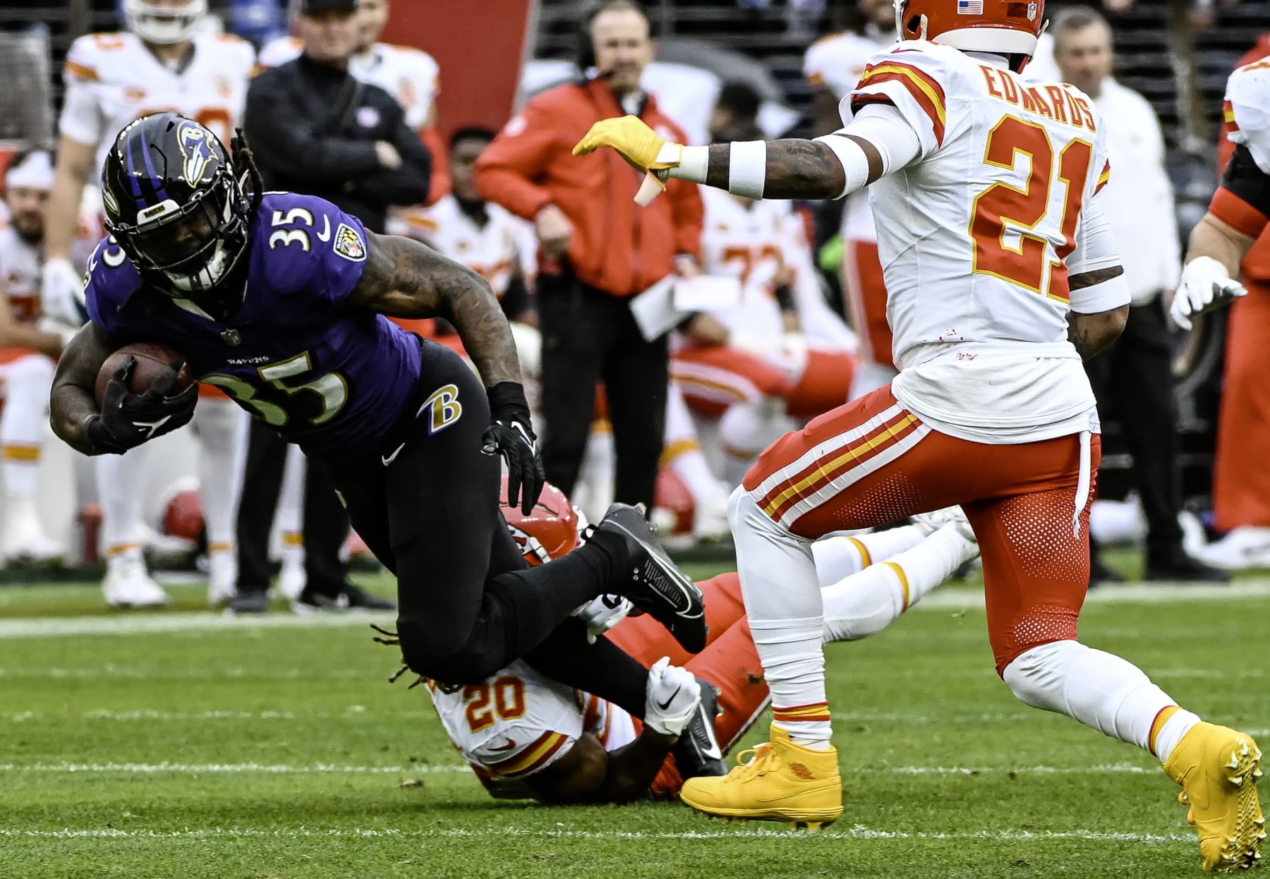 BALTIMORE, MD - JANUARY 28:  Kansas City Chiefs safety Justin Reid (20) brings down Baltimore Ravens running back Gus Edwards (35) during the Kansas City Chiefs game versus the Baltimore Ravens in the AFC Championship Game on January 28, 2024 at M&T Bank Stadium in Baltimore, MD.  (Photo by Mark Goldman/Icon Sportswire via Getty Images)