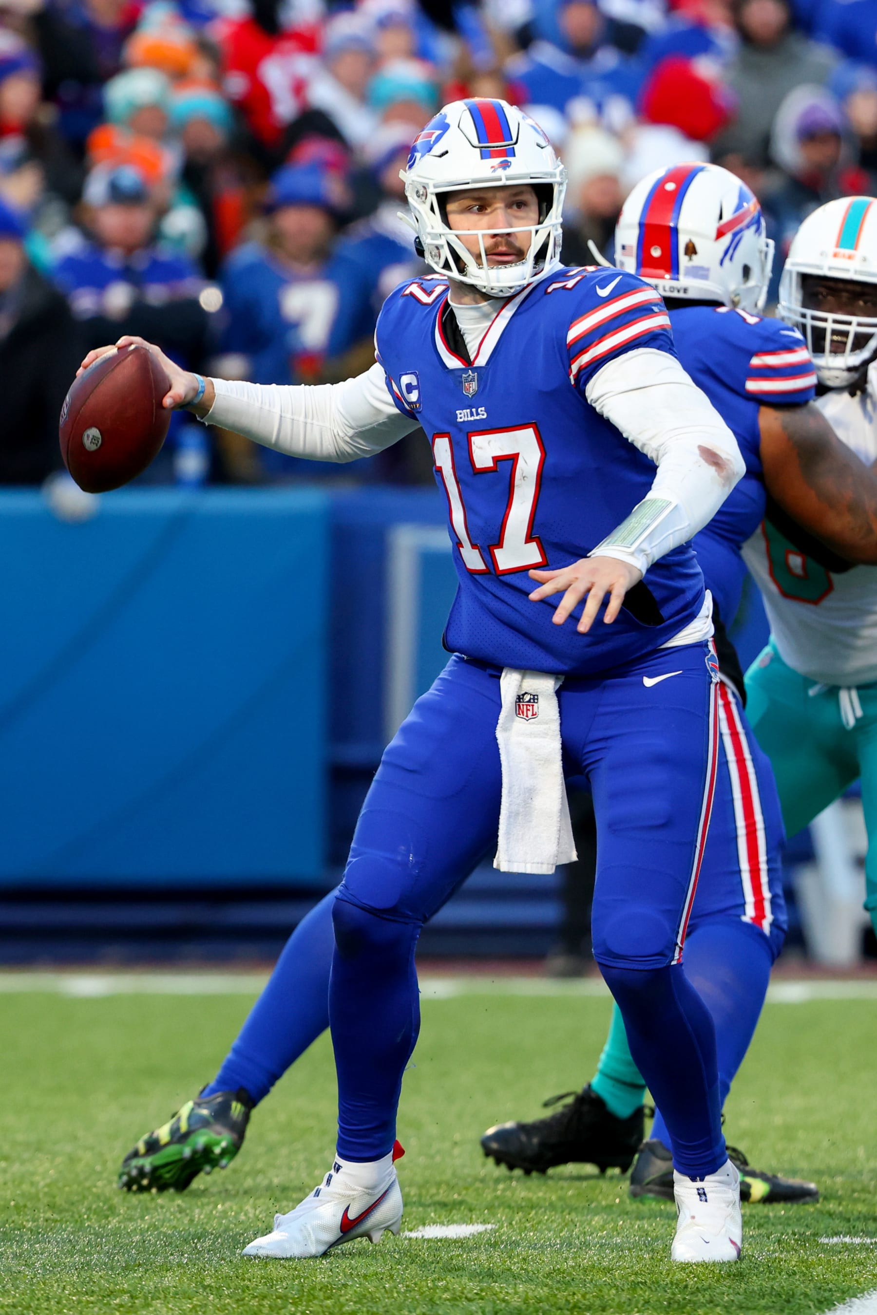 ORCHARD PARK, NEW YORK - JANUARY 15: Josh Allen #17 of the Buffalo Bills throws a pass against the Miami Dolphins during the second half of the game in the AFC Wild Card playoff game at Highmark Stadium on January 15, 2023 in Orchard Park, New York. (Photo by Timothy T Ludwig/Getty Images)