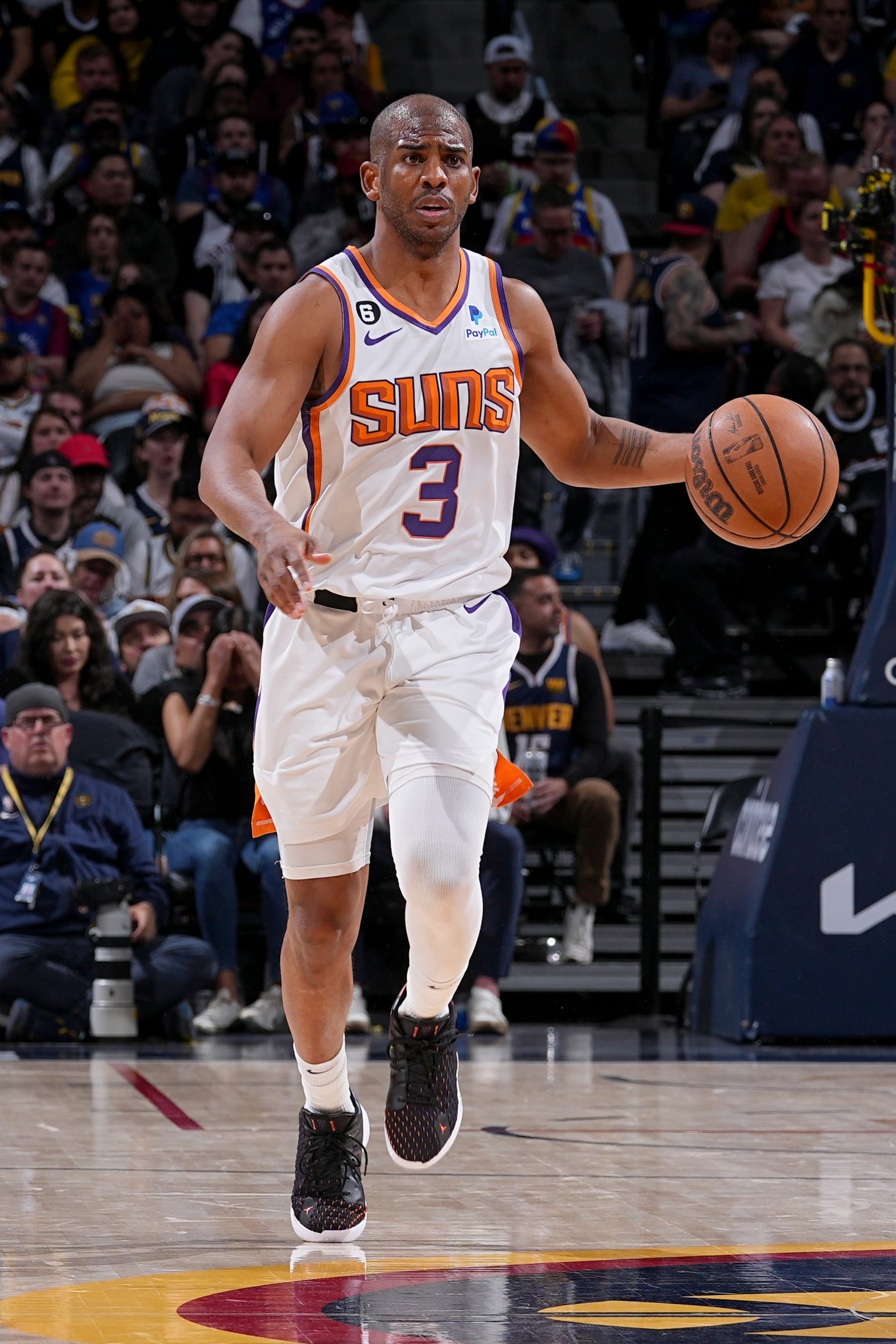 DENVER, CO - MAY 1:  Chris Paul #3 of the Phoenix Suns dribbles the ball against the Denver Nuggets during Round 2 Game 2 of the 2023 NBA Playoffs on May 1, 2023 at the Ball Arena in Denver, Colorado. NOTE TO USER: User expressly acknowledges and agrees that, by downloading and/or using this Photograph, user is consenting to the terms and conditions of the Getty Images License Agreement. Mandatory Copyright Notice: Copyright 2023 NBAE (Photo by Bart Young/NBAE via Getty Images)