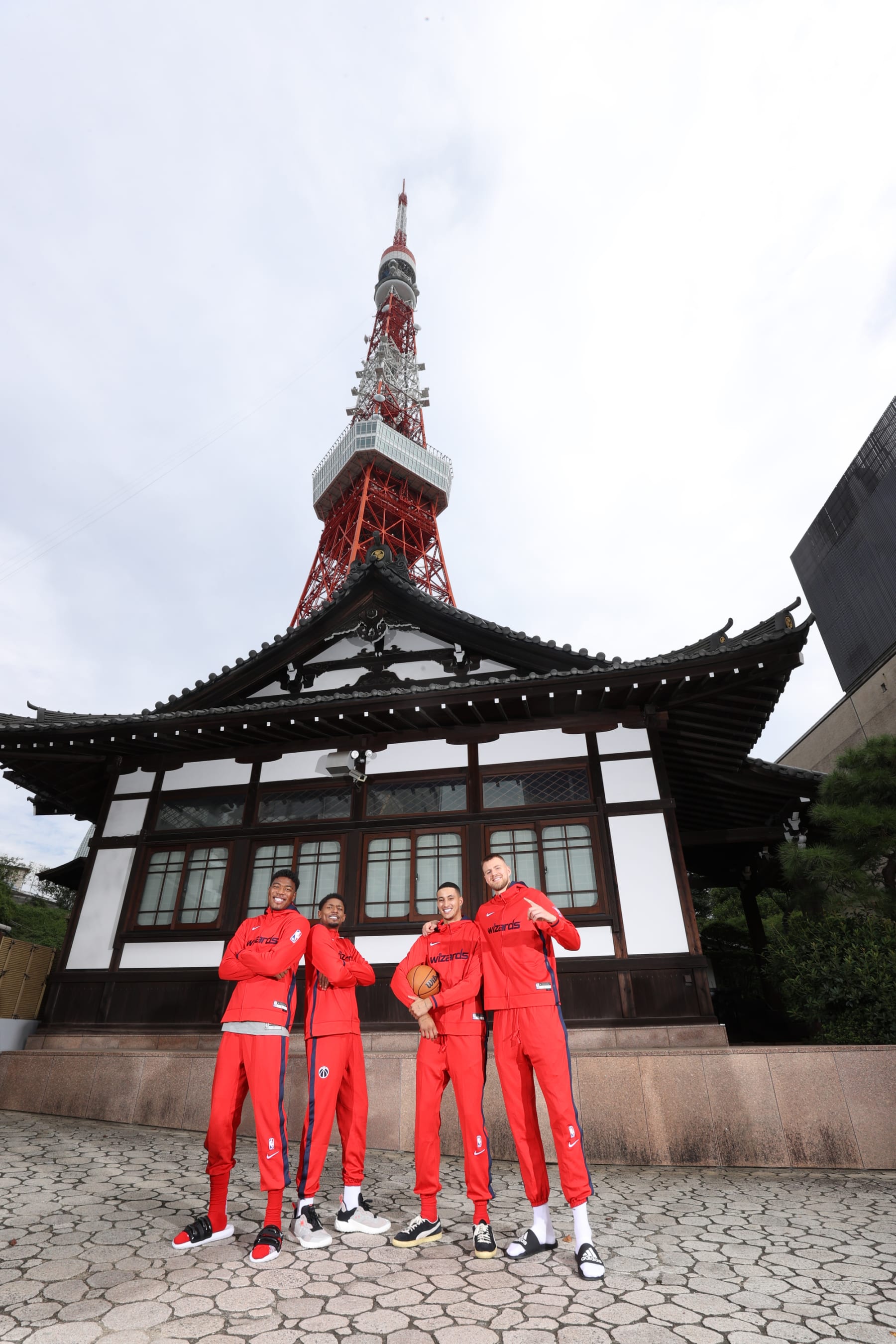 TOKYO, JAPAN - SEPTEMBER 29: Rui Hachimura, Bradley Beal, Kyle Kuzma, and Kristaps Porzingis of the Washington Wizards poses for a group photo by the Tokyo Tower on September 29, 2022 in Tokyo, Japan. NOTE TO USER: User expressly acknowledges and agrees that, by downloading and/or using this Photograph, user is consenting to the terms and conditions of the Getty Images License Agreement. Mandatory Copyright Notice: Copyright 2022 NBAE (Photo by Stephen Gosling/NBAE via Getty Images)