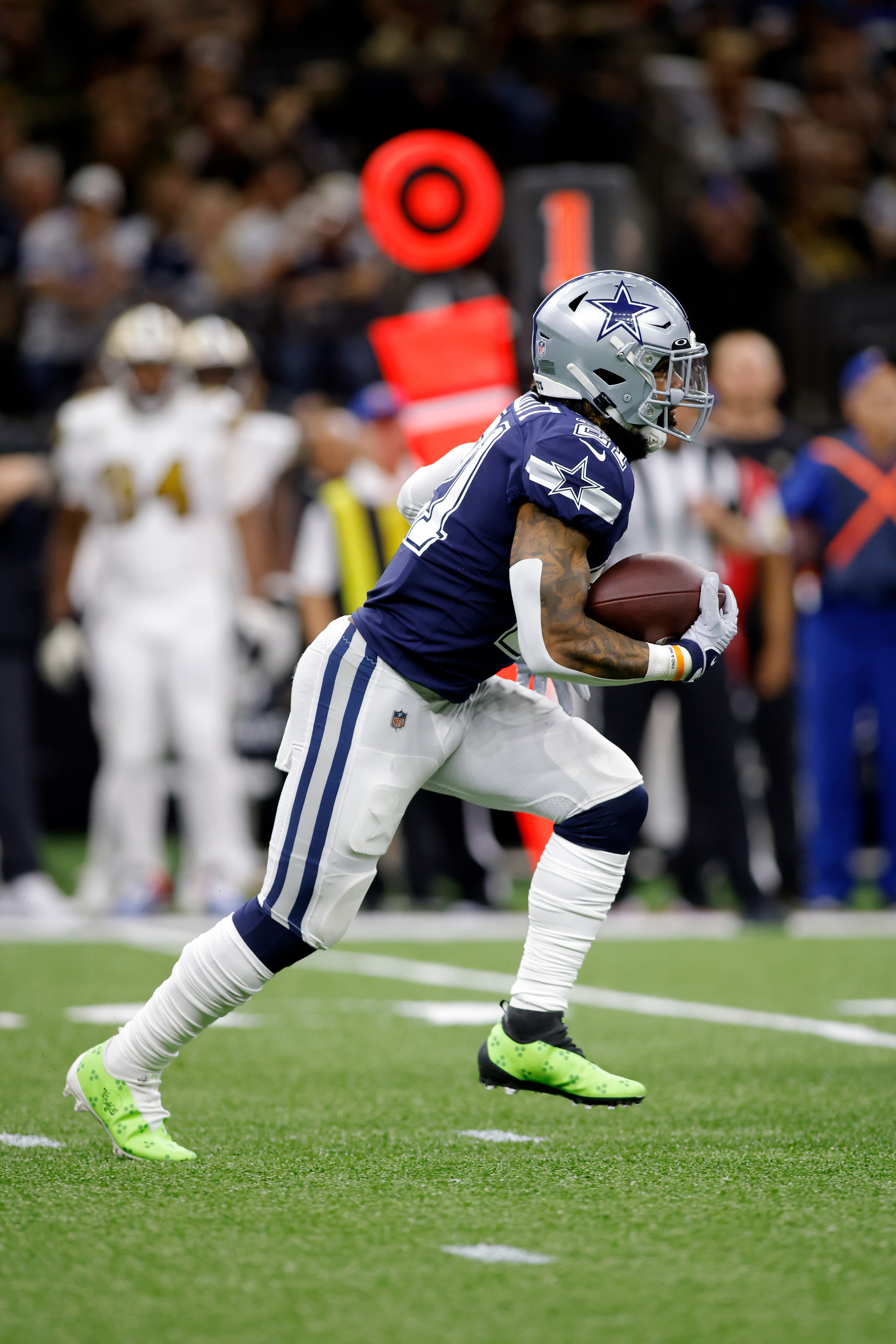 Dallas Cowboys running back Ezekiel Elliott (21) runs the ball during an NFL football game against the New Orleans Saints, Thursday, Dec. 2, 2021, in New Orleans. (AP Photo/Tyler Kaufman)