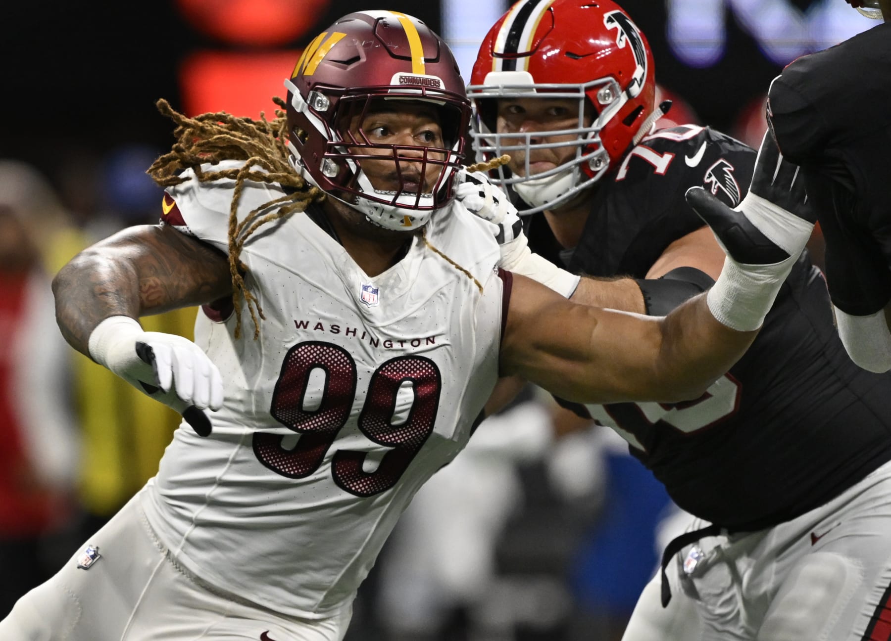 ATLANTA, GA - OCTOBER 15:  Washington Commanders defensive end Chase Young (99) against Atlanta Falcons offensive tackle Jake Matthews (70) during the Washington Commanders defeat of the Atlanta Falcons  24-16 at the Mercedes-Benz Stadium in Atlanta, GA on October 15, 2023. (Photo by John McDonnell/The Washington Post via Getty Images)