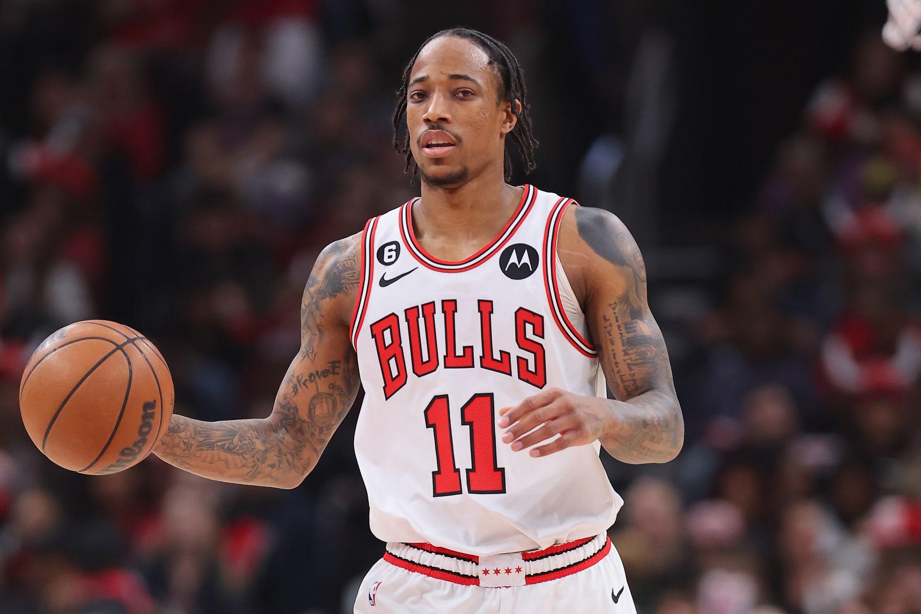 CHICAGO, ILLINOIS - JANUARY 07: DeMar DeRozan #11 of the Chicago Bulls dribbles up the court against the Utah Jazz during the first half at United Center on January 07, 2023 in Chicago, Illinois. NOTE TO USER: User expressly acknowledges and agrees that, by downloading and or using this photograph, User is consenting to the terms and conditions of the Getty Images License Agreement. (Photo by Michael Reaves/Getty Images)