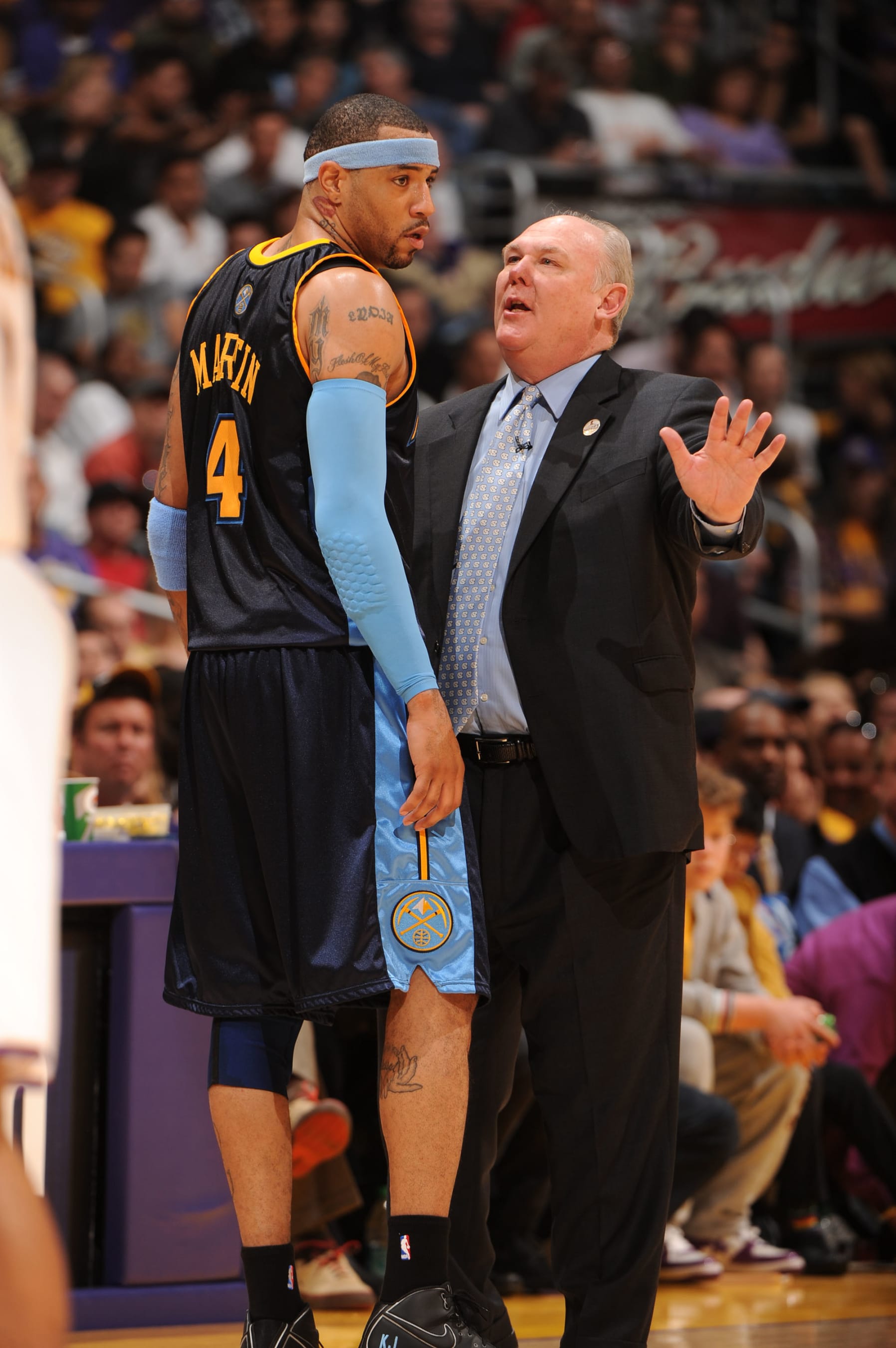 LOS ANGELES - FEBRUARY 28:  Kenyon Martin #4 of the Denver Nuggets receives direction from Head Coach George Karl during a game against the Los Angeles Lakers at Staples Center on February 28, 2010 in Los Angeles, California. NOTE TO USER: User expressly acknowledges and agrees that, by downloading and/or using this Photograph, user is consenting to the terms and conditions of the Getty Images License Agreement. Mandatory Copyright Notice: Copyright 2010 NBAE (Photo by Andrew D. Bernstein/NBAE via Getty Images)