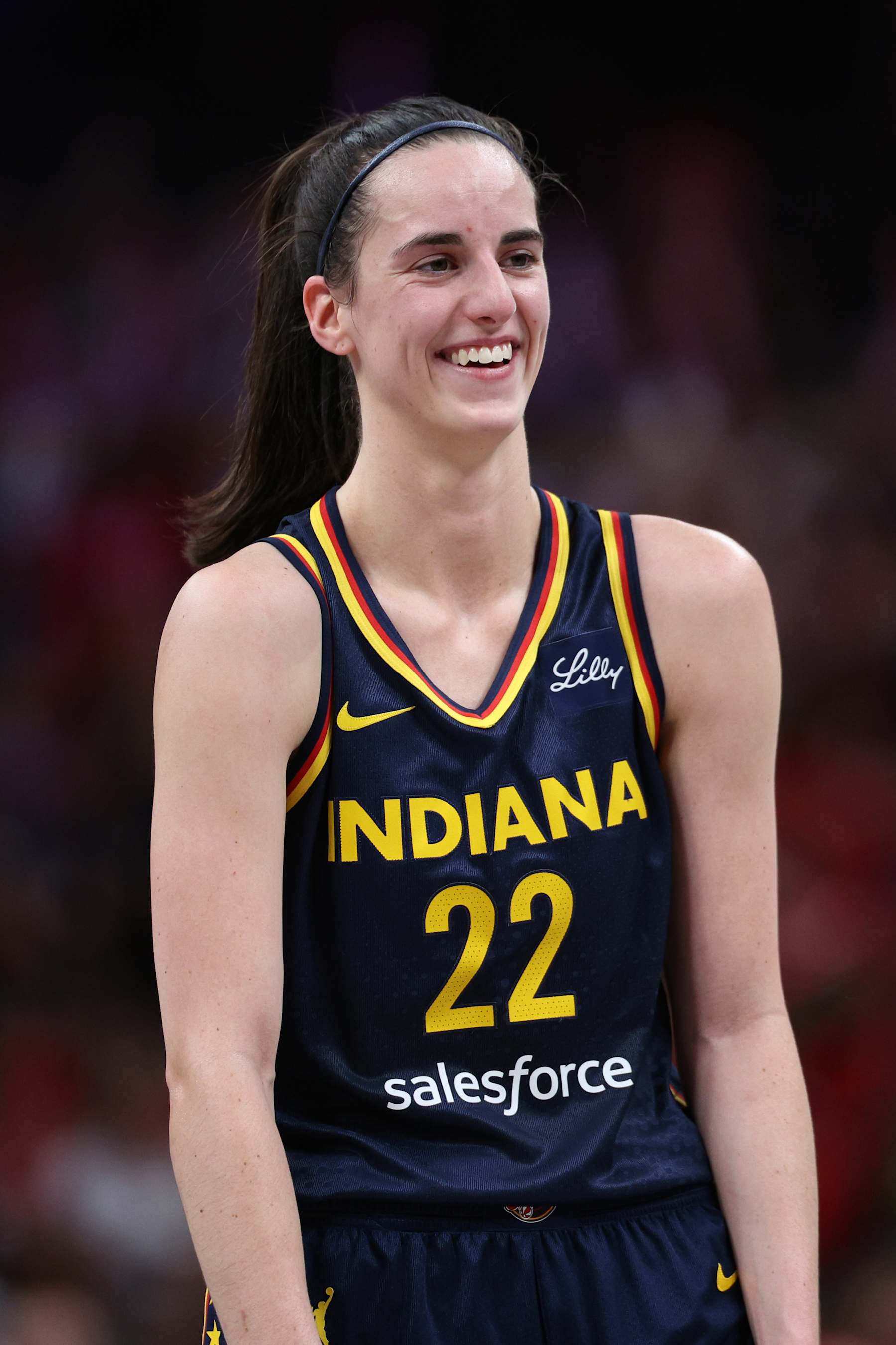 INDIANAPOLIS, IN - SEPTEMBER 15: Caitlin Clark #22 of the Indiana Fever smiles during the game against the Dallas Wings on September 15, 2024 at Gainbridge Fieldhouse in Indianapolis, Indiana. NOTE TO USER: User expressly acknowledges and agrees that, by downloading and or using this Photograph, user is consenting to the terms and conditions of the Getty Images License Agreement. Mandatory Copyright Notice: Copyright 2024 NBAE (Photo by Michael Hickey/NBAE via Getty Images)