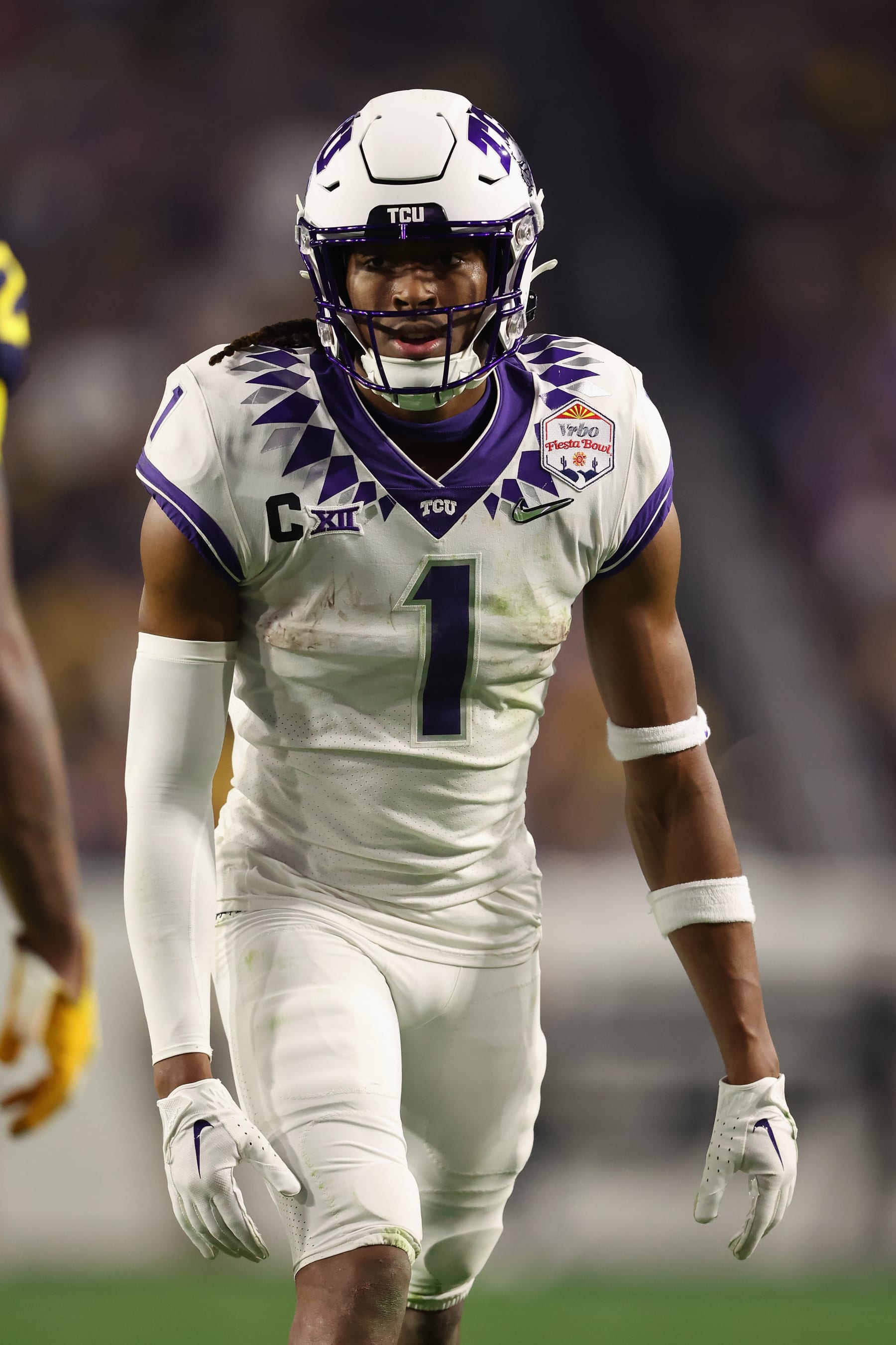 GLENDALE, ARIZONA - DECEMBER 31: Wide receiver Quentin Johnston #1 of the TCU Horned Frogs lines up against the Michigan Wolverines during the fourth quarter of the Vrbo Fiesta Bowl at State Farm Stadium on December 31, 2022 in Glendale, Arizona. The Horned Frogs defeated the Wolverines 51-45.  (Photo by Christian Petersen/Getty Images)
