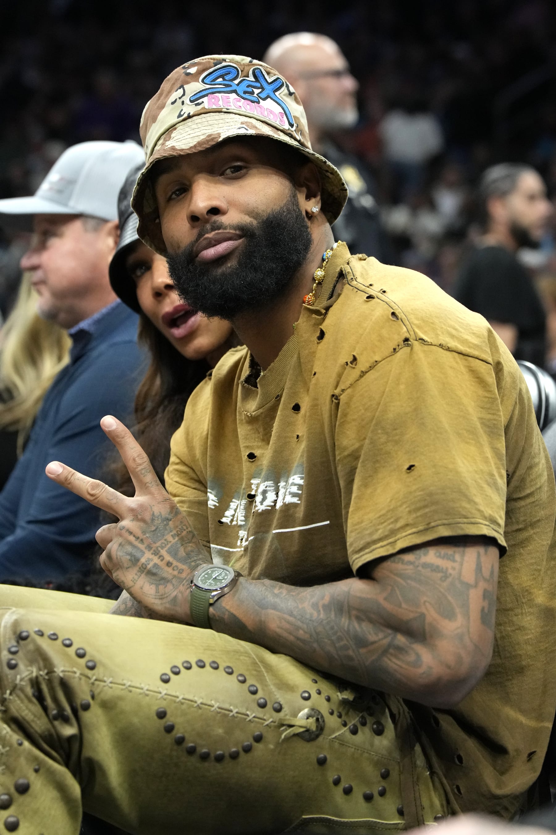 Odell Beckham Jr poses for an image during the first half of an NBA basketball game between the Phoenix Suns and the Oklahoma City Thunder, Friday, Feb. 24, 2023, in Phoenix. (AP Photo/Rick Scuteri)