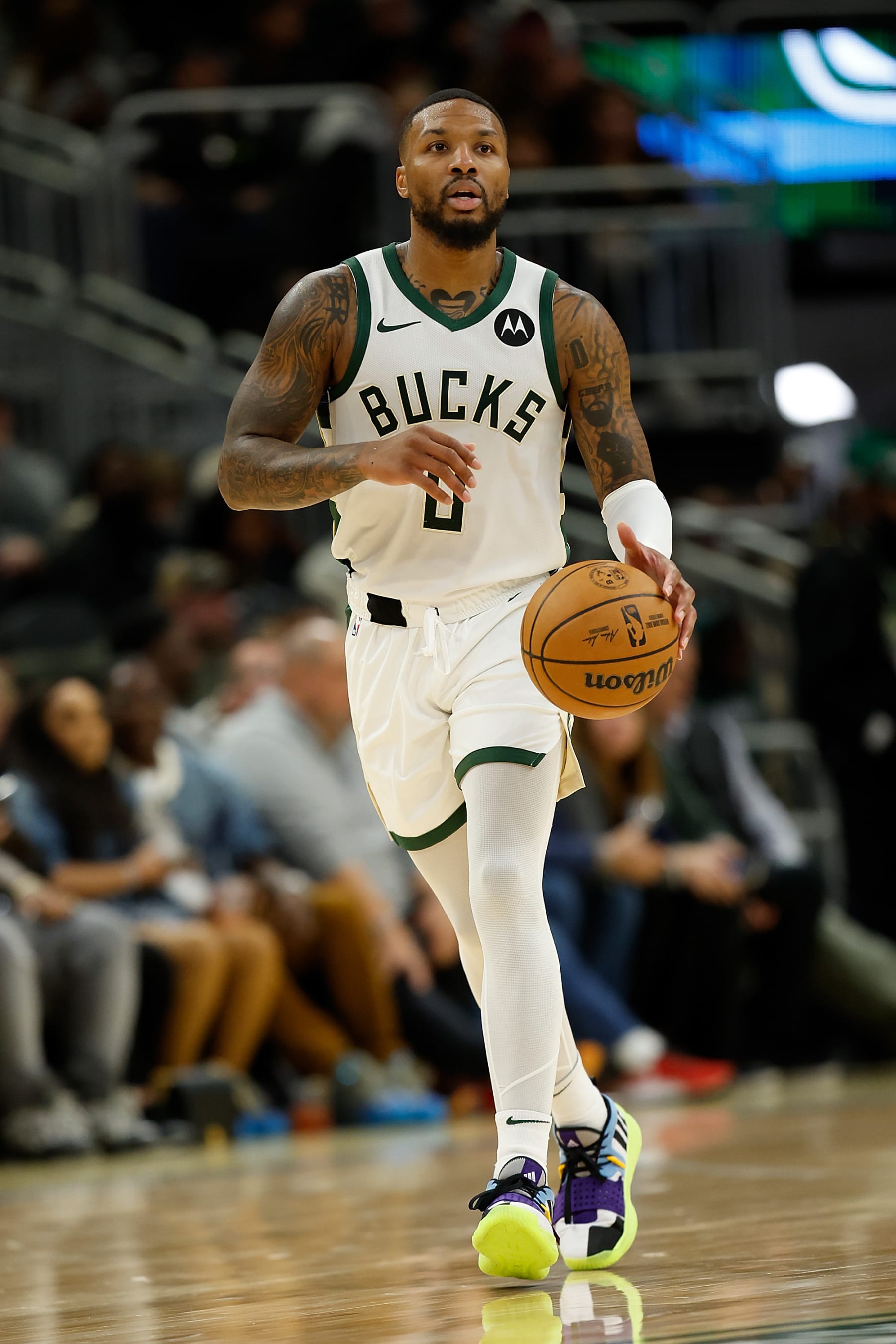MILWAUKEE, WISCONSIN - OCTOBER 20: Damian Lillard #0 of the Milwaukee Bucks dribbles up court during the preseason game against the Memphis Grizzlies at Fiserv Forum on October 20, 2023 in Milwaukee, Wisconsin. NOTE TO USER: User expressly acknowledges and agrees that, by downloading and or using this photograph, User is consenting to the terms and conditions of the Getty Images License Agreement. (Photo by John Fisher/Getty Images)