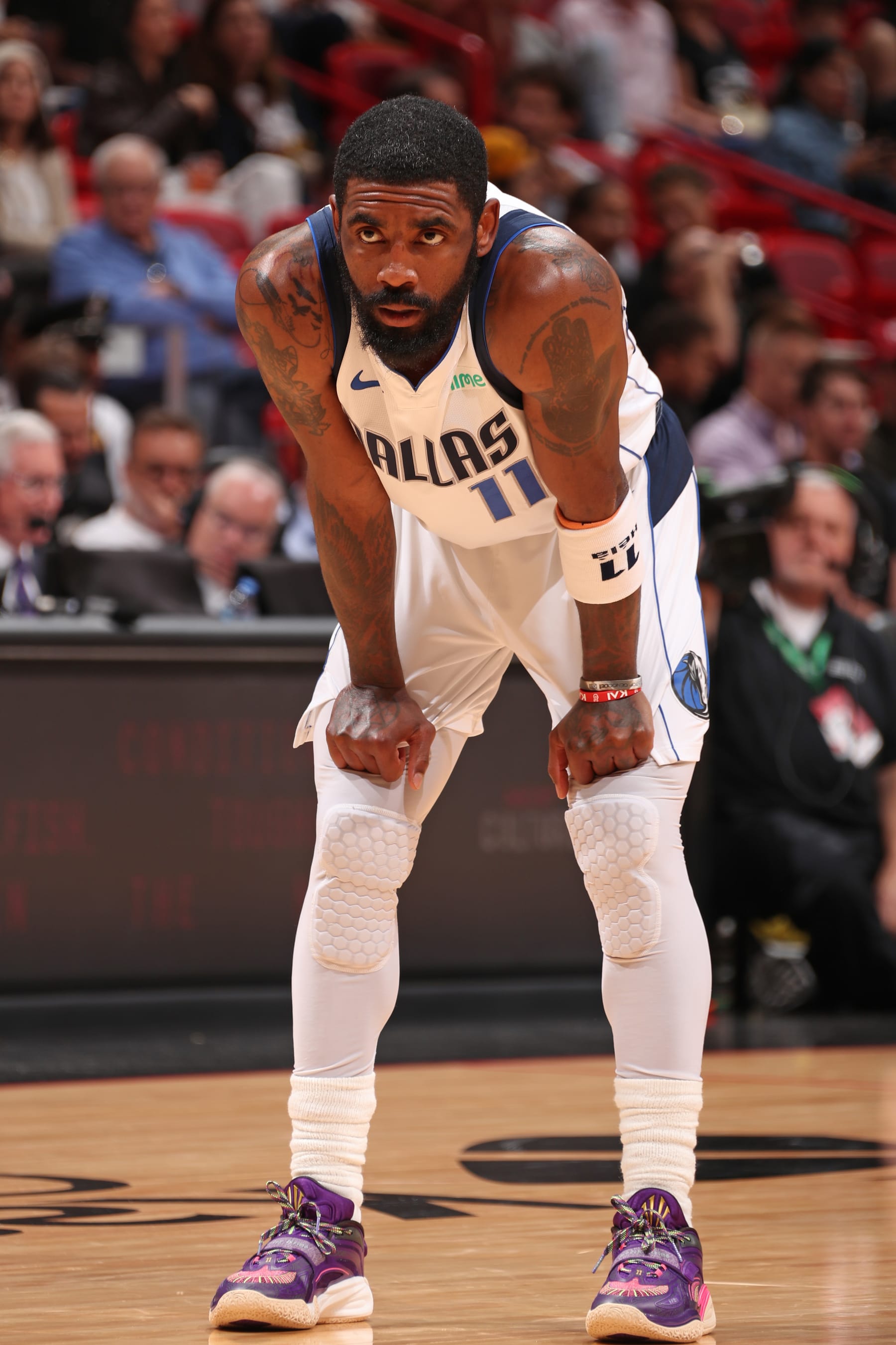 MIAMI, FL - APRIL 10:  Kyrie Irving #11 of the Dallas Mavericks looks on during the game against the Miami Heat on April 10, 2024 at Kaseya Center in Miami, Florida. NOTE TO USER: User expressly acknowledges and agrees that, by downloading and or using this Photograph, user is consenting to the terms and conditions of the Getty Images License Agreement. Mandatory Copyright Notice: Copyright 2024 NBAE (Photo by Issac Baldizon/NBAE via Getty Images)